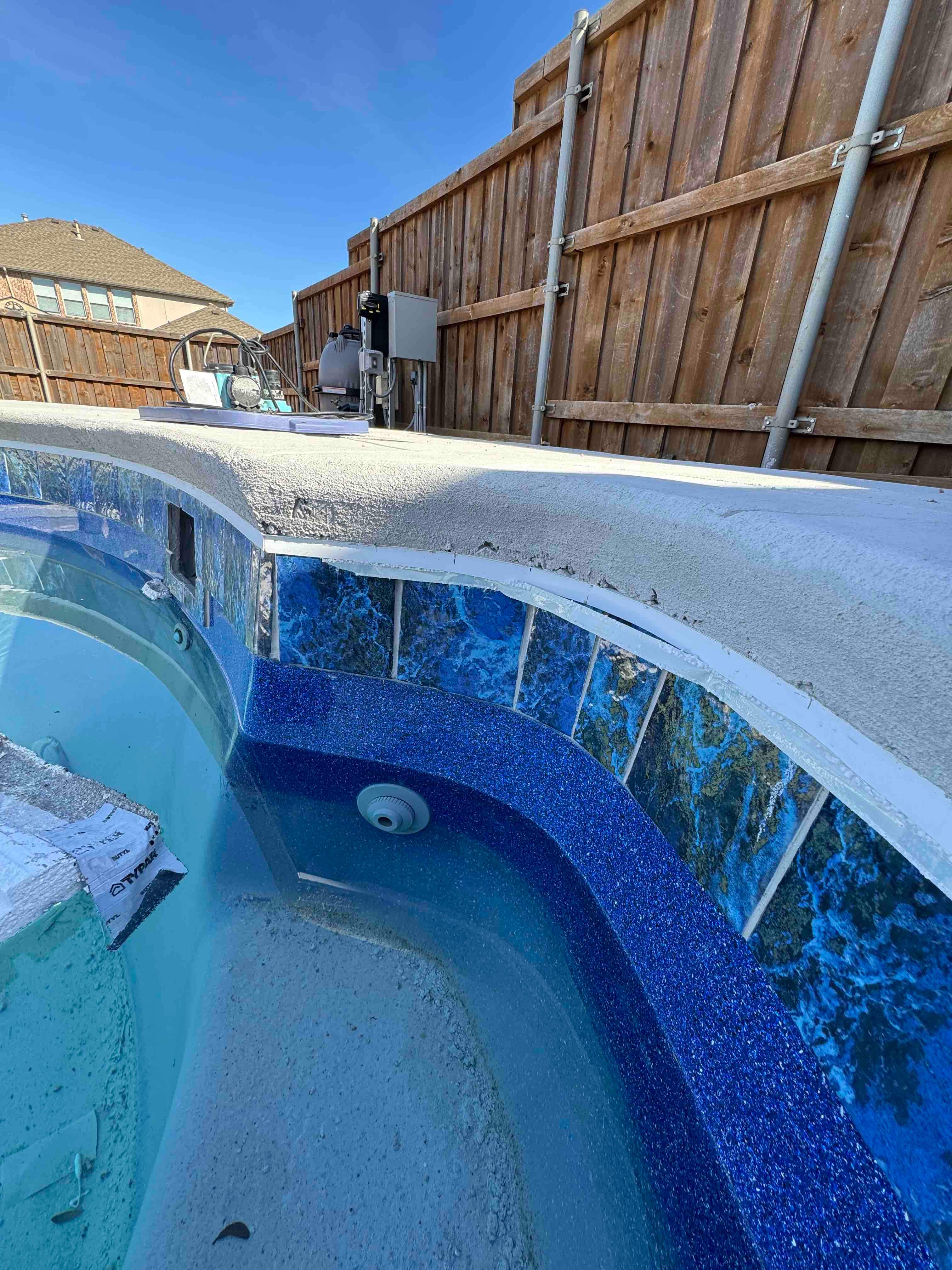 Freeform Pool with Raised Spa and Blue Tile by Pinnacle Pools and Spas - DFW