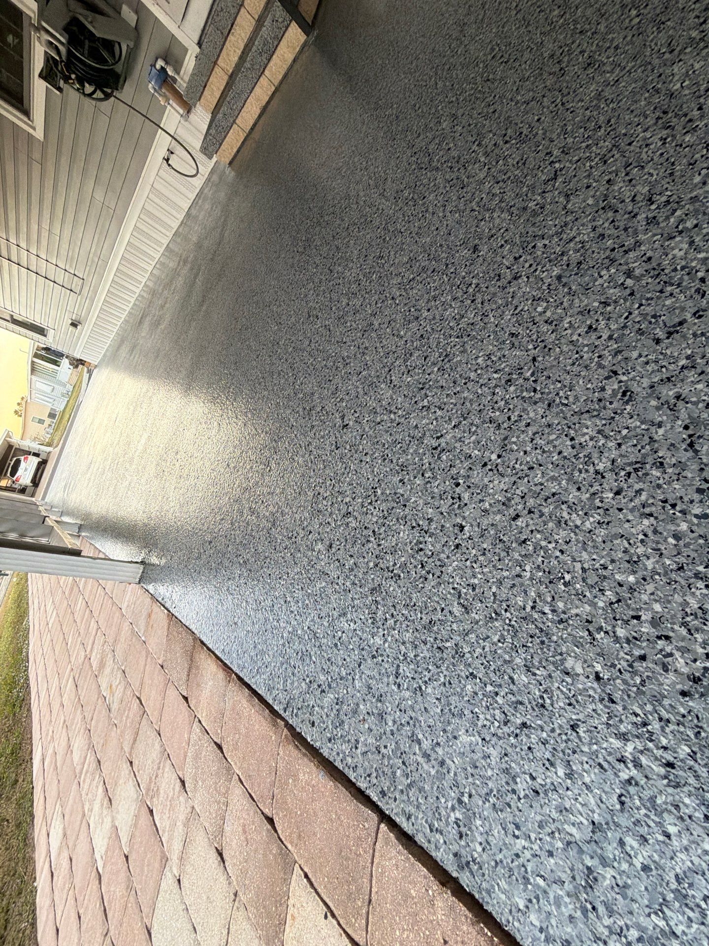 Driveway Transformation: Nightfall Flake System with Full UV & Moisture Protection by Performance Floors & Coating