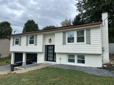 James Hardie Remodel Featuring Copper Gutters and Paint in Cream