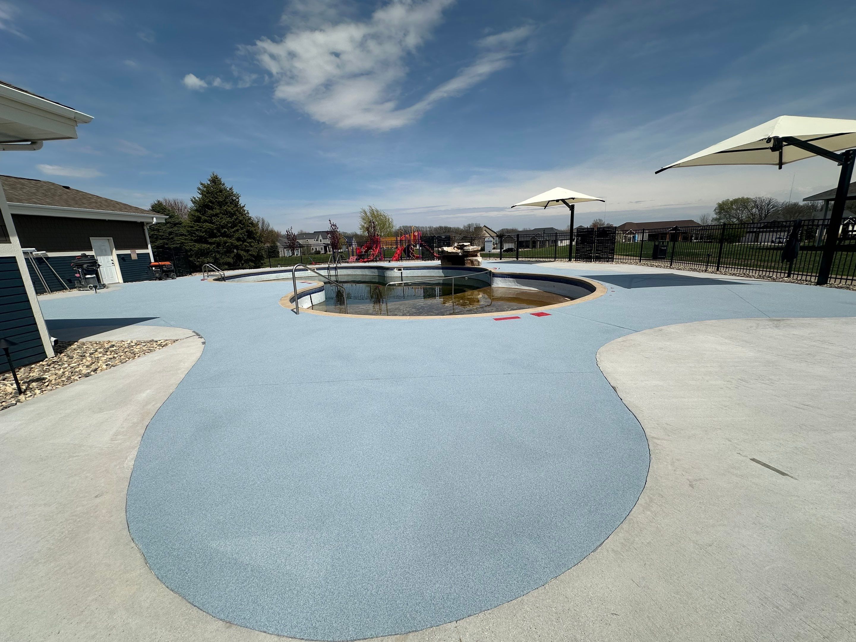Arbors Edge Pool Deck Restoration and Textured Concrete Coating by Select Painting, Coatings & Garage Cabinets