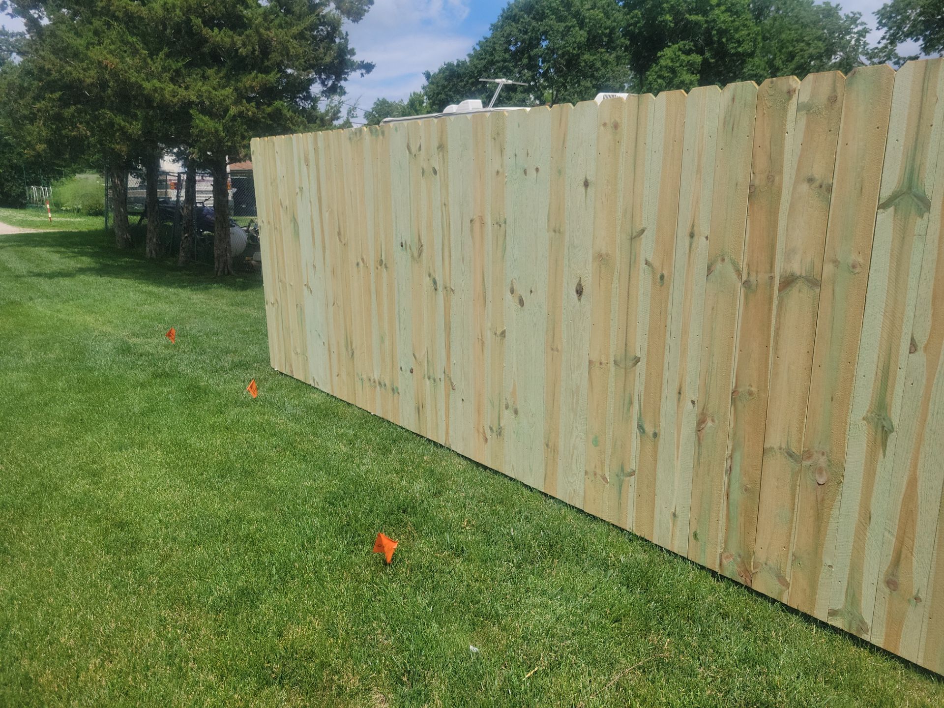 Pressure-Treated Wood Privacy Fence Installation in Charles City by Perfect Picket Fence and Stain