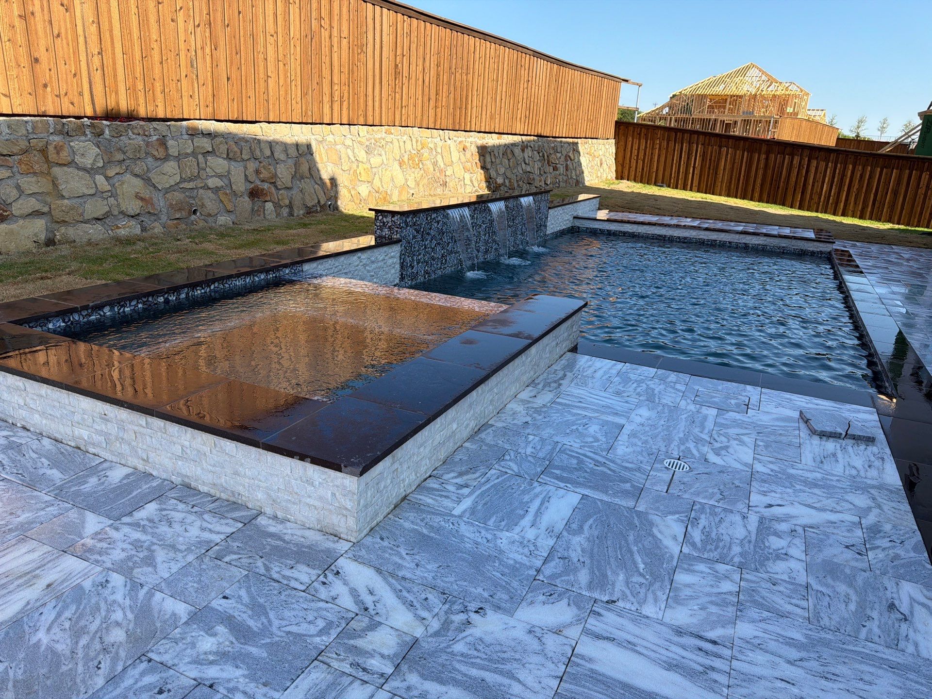 Modern Geometric Pool with Raised Spa and Marble Deck by Pinnacle Pools and Spas - DFW