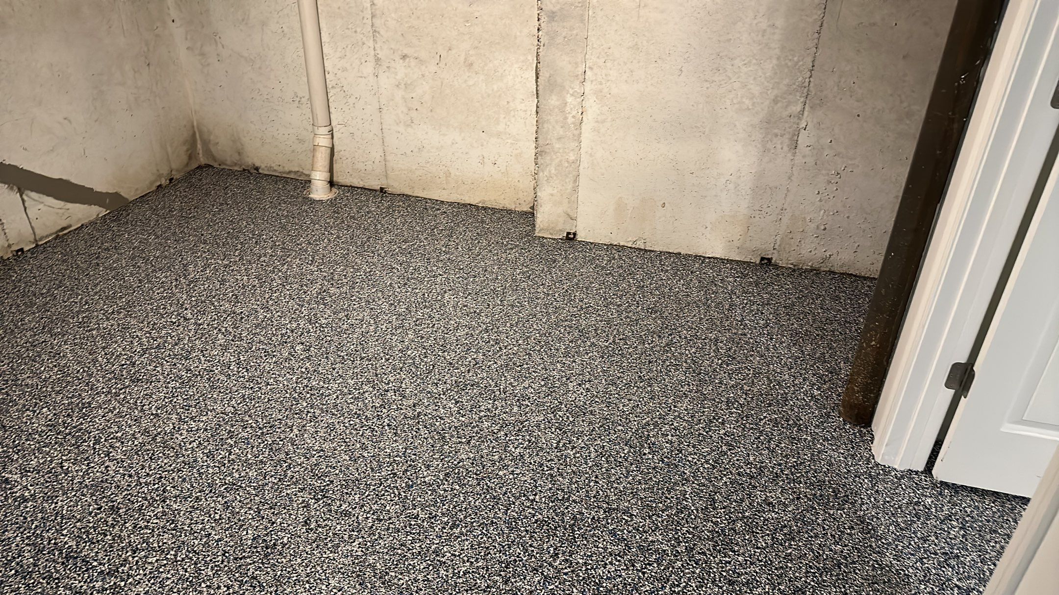 A beautiful Banner Garage Coating in a basement  by Banner Garage