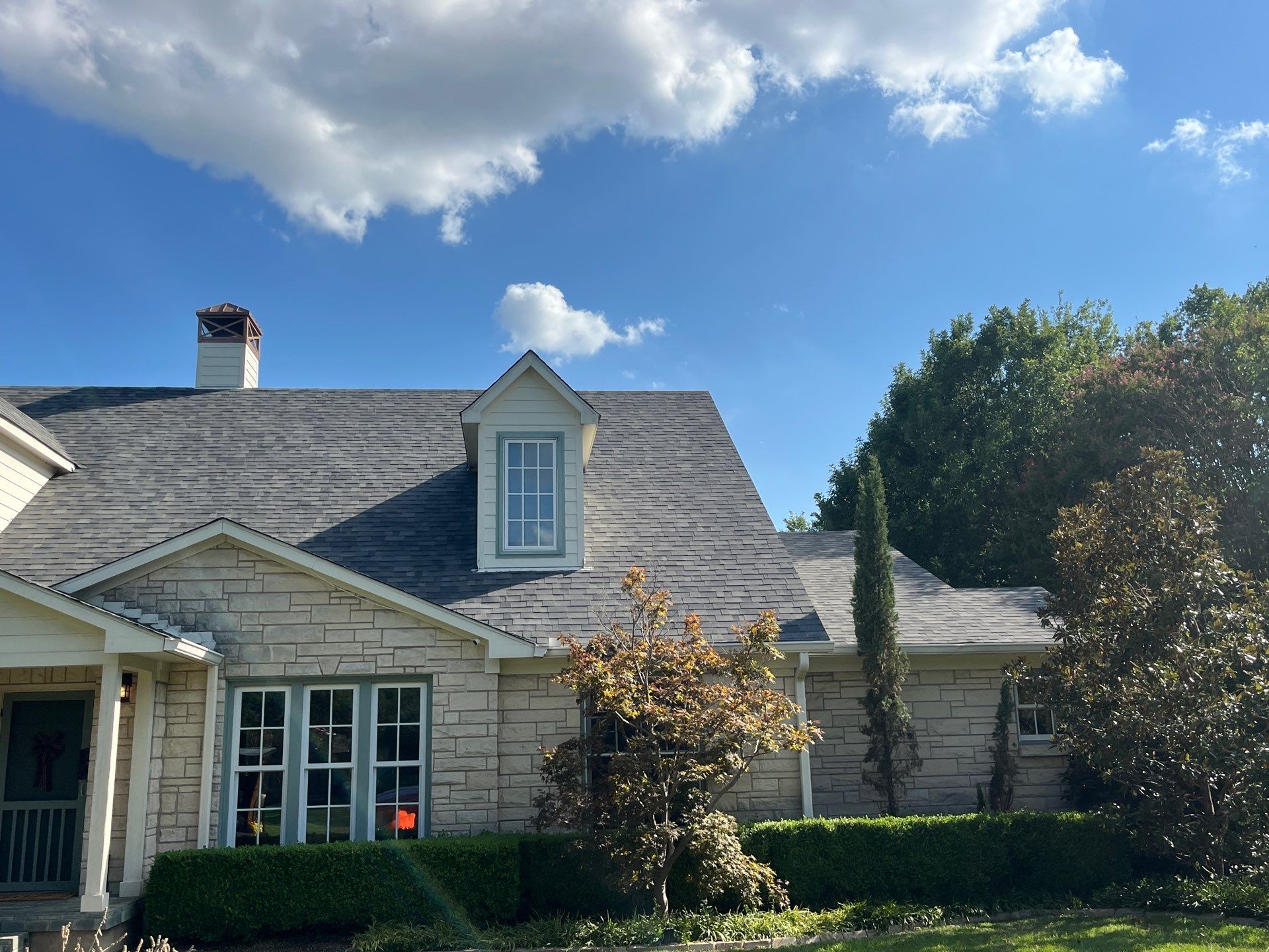 White brick with Malarkey Storm Grey by Tejas Roofworks + Restoration