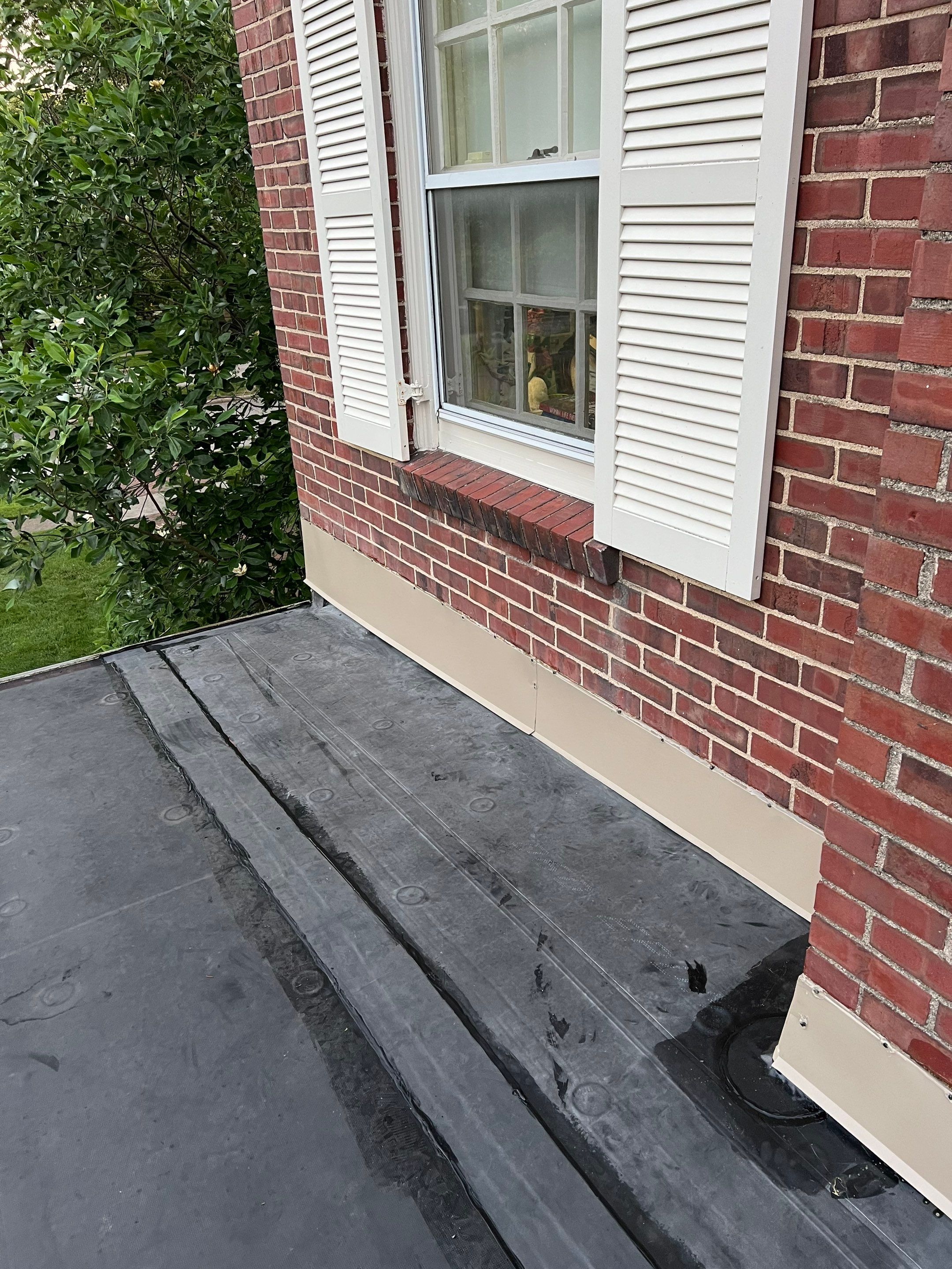Residential Roofing Installation using 60 mil rubber roof  by Nitro Roofing and Construction