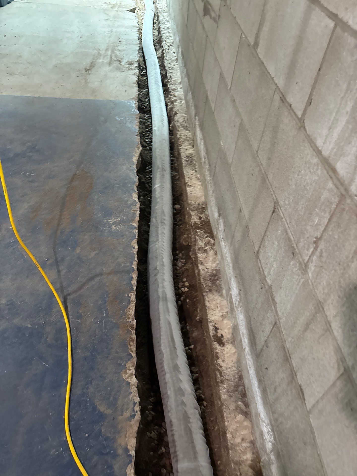 Interior Drain Tile & Buried Discharge in South Minneapolis by Waterproofing Northeast