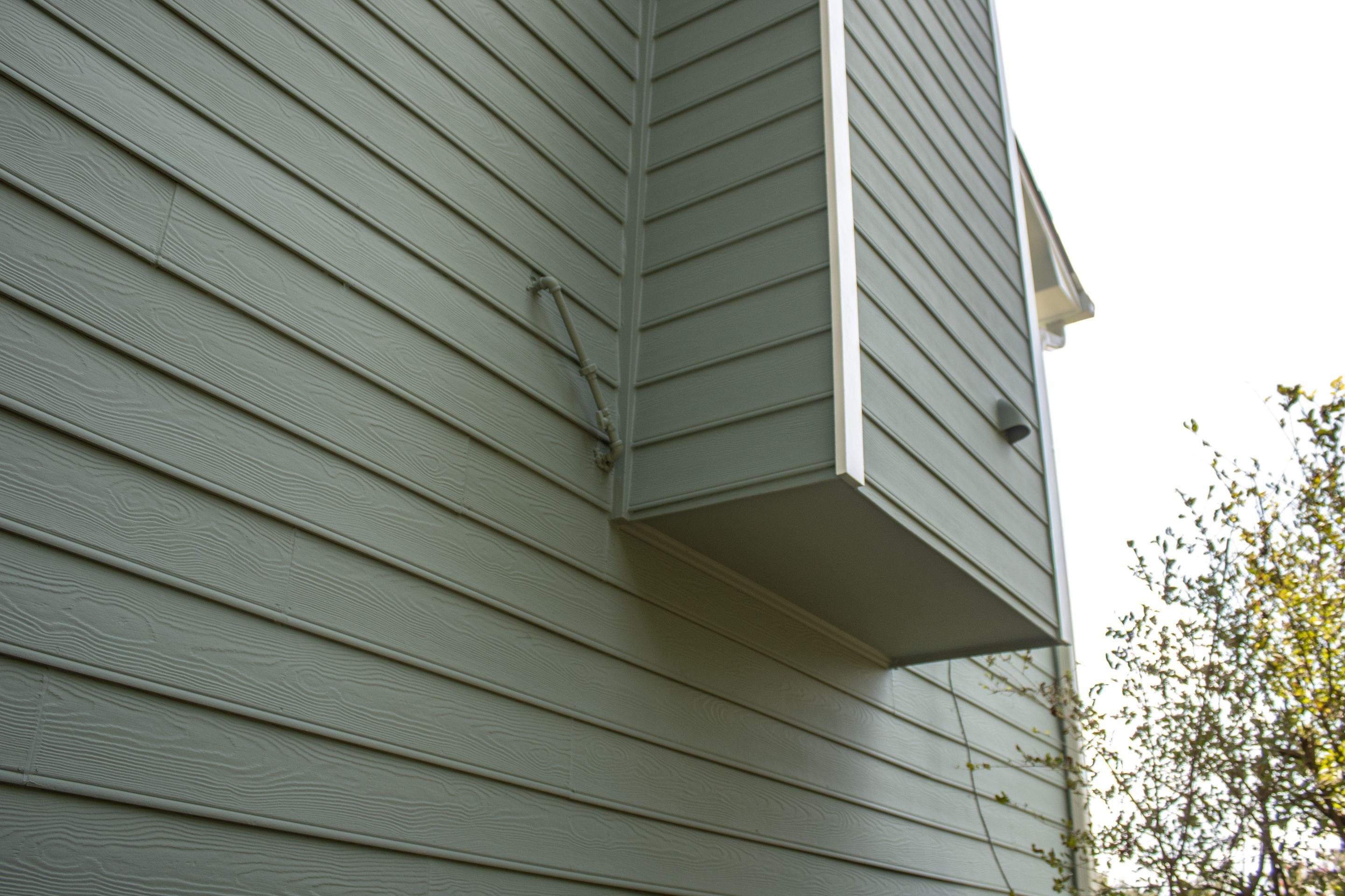 Alpharetta, GA Partial Siding Replacement, Porch Stain, and Exterior Painting by Nelson Exteriors 