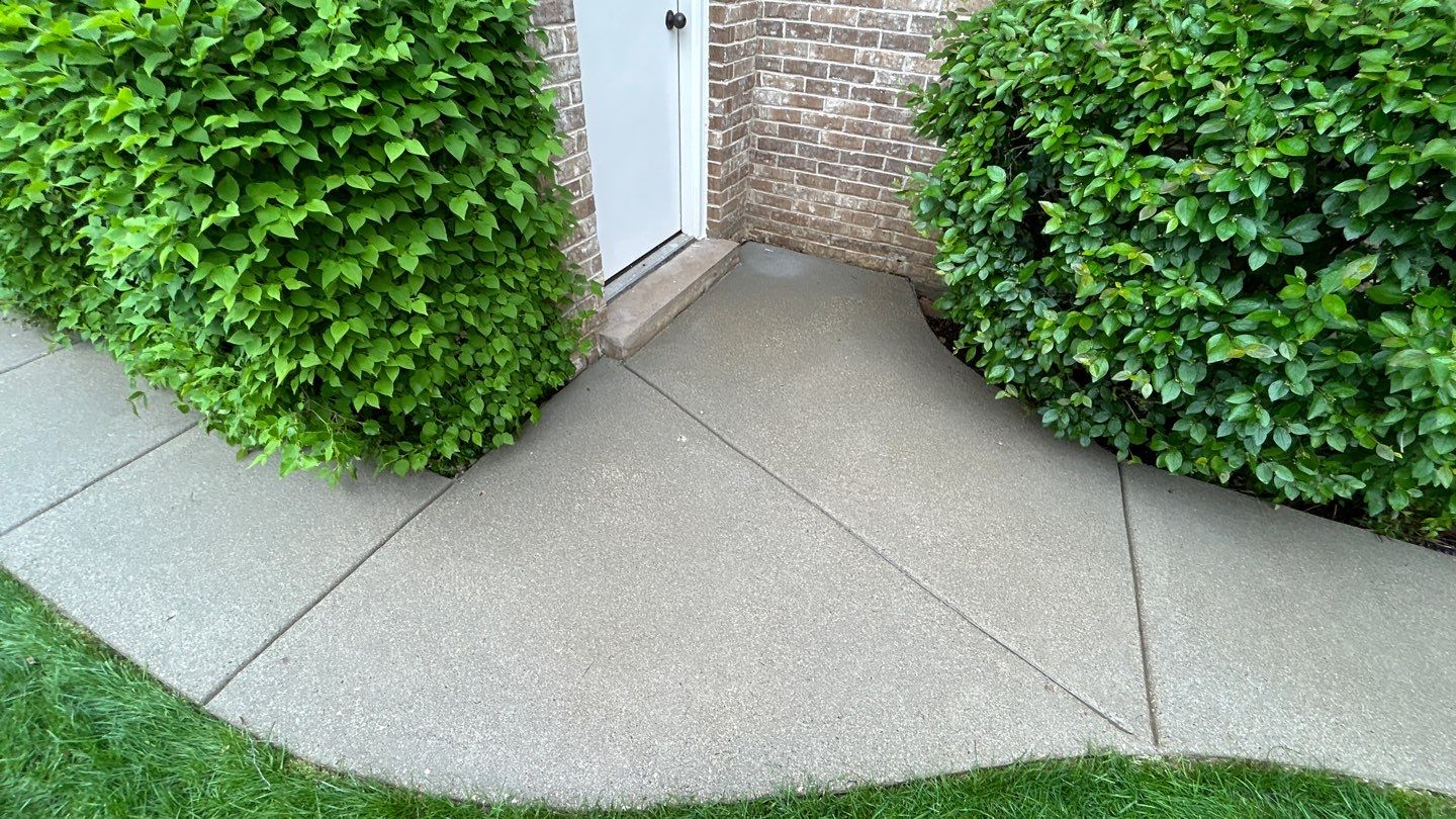 concrete patio and driveway cleaning by Northern Power Washing LLC.