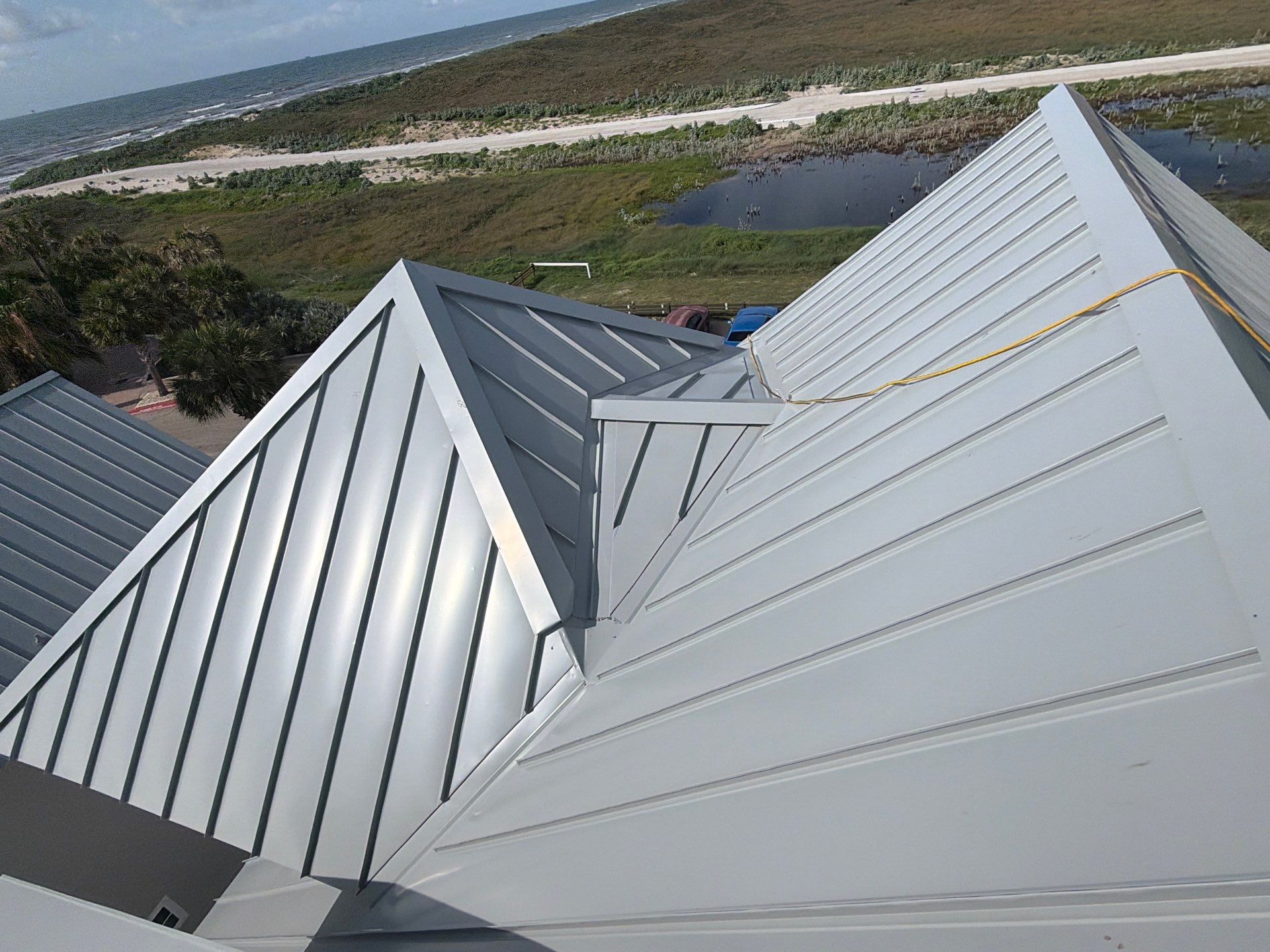 Residential Roof Replacement using .032 Standing Seam Doublelock - Aluminum by Action Exteriors Austin
