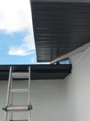 Black Seamless Gutters and Downspouts in Siesta Key FL