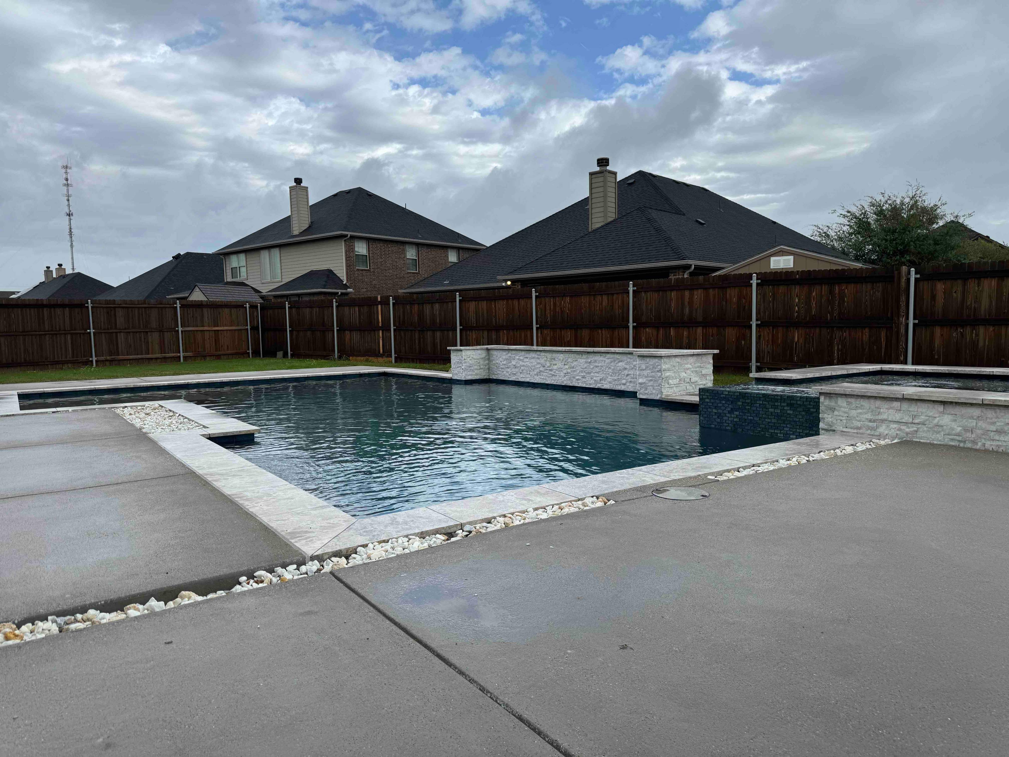 Geometric Pool with Raised Spa and Stone Coping by Pinnacle Pools and Spas - DFW