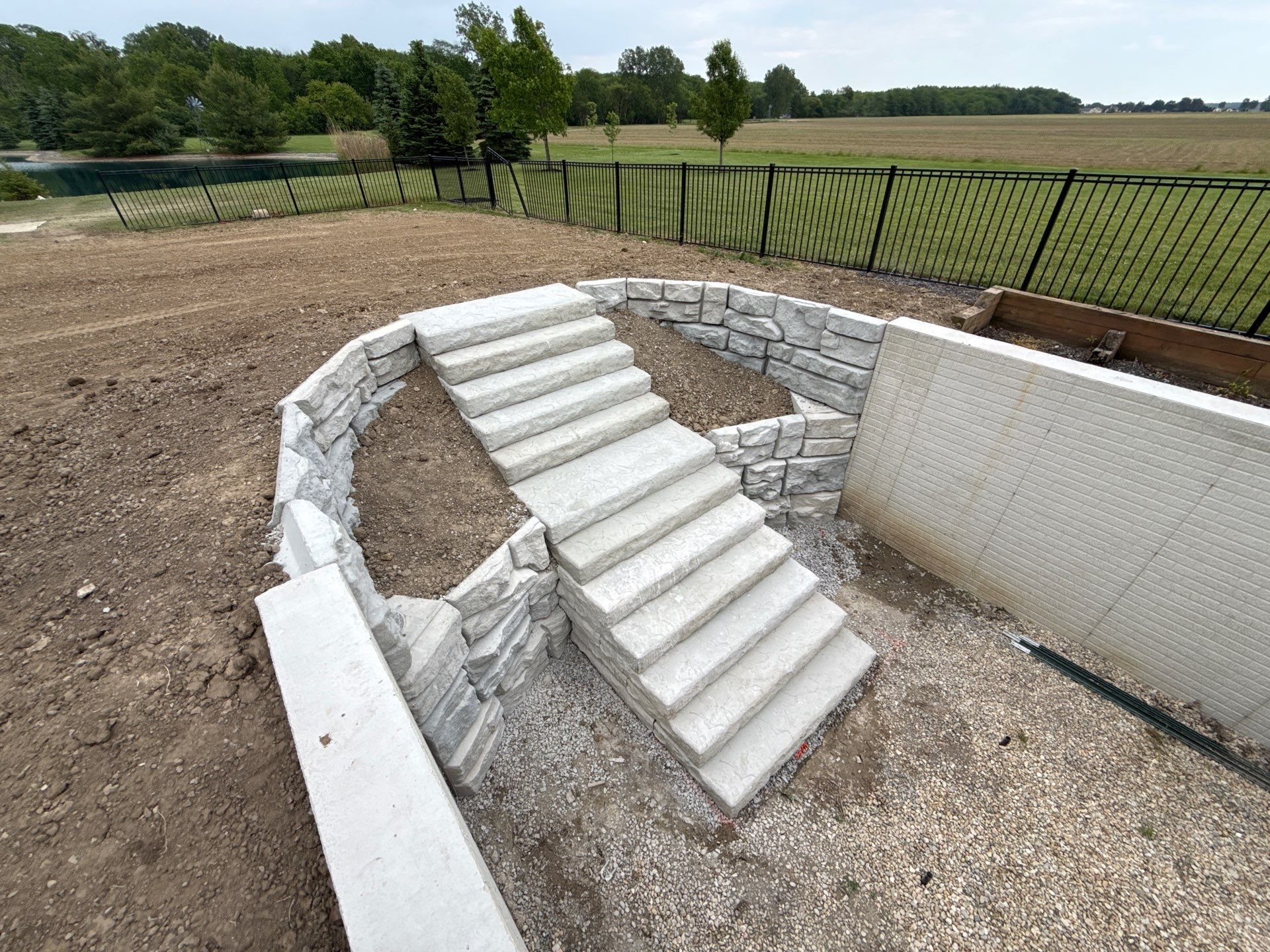 Basement Walkout Construction with Tiered Retaining Walls in Berkey by Farrell's Lawn & Garden Center LLC