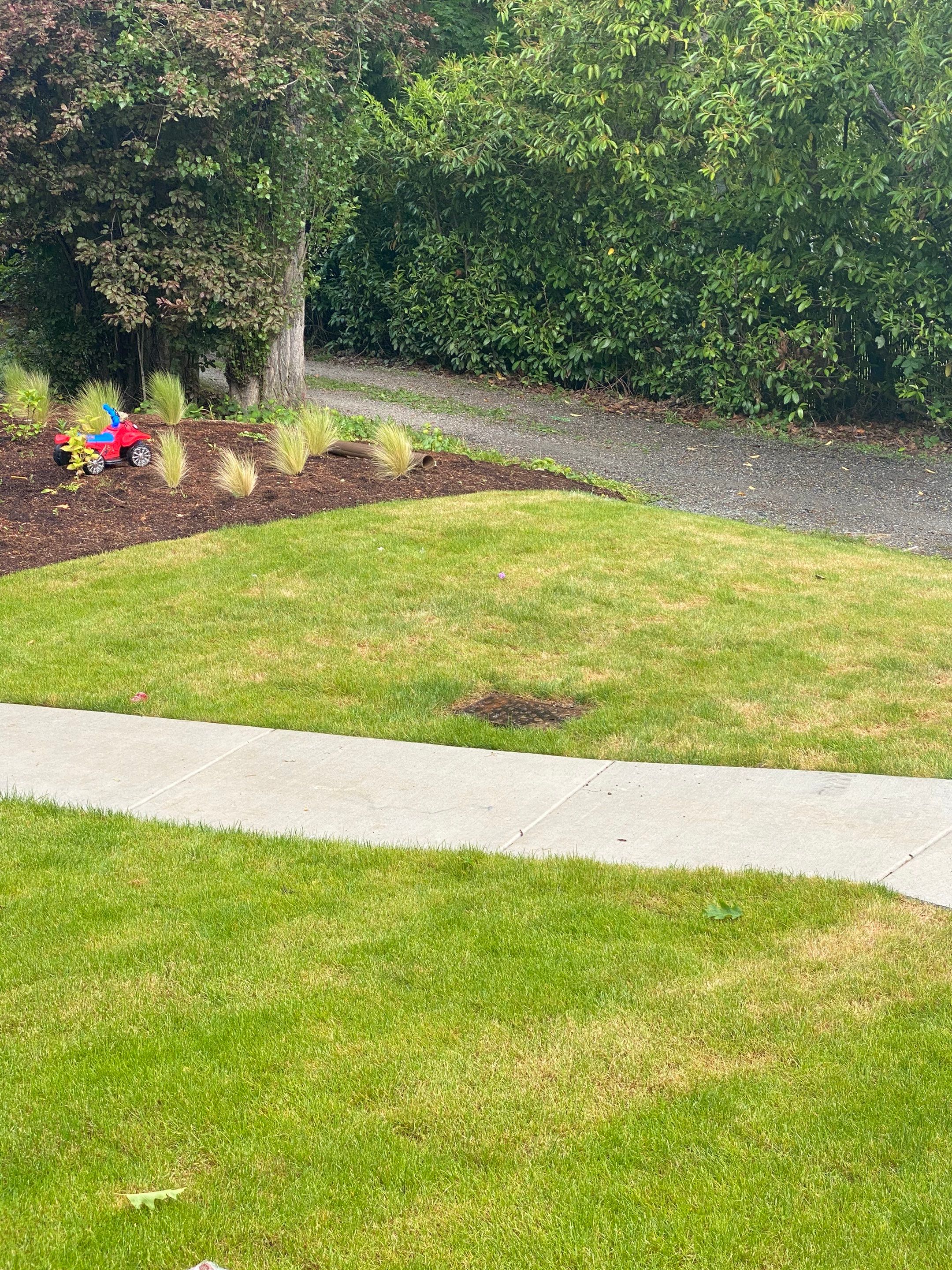 Patio Installation using Concrete, Retaining walls, and Turf install by Jireh Asphalt & Concrete Inc 