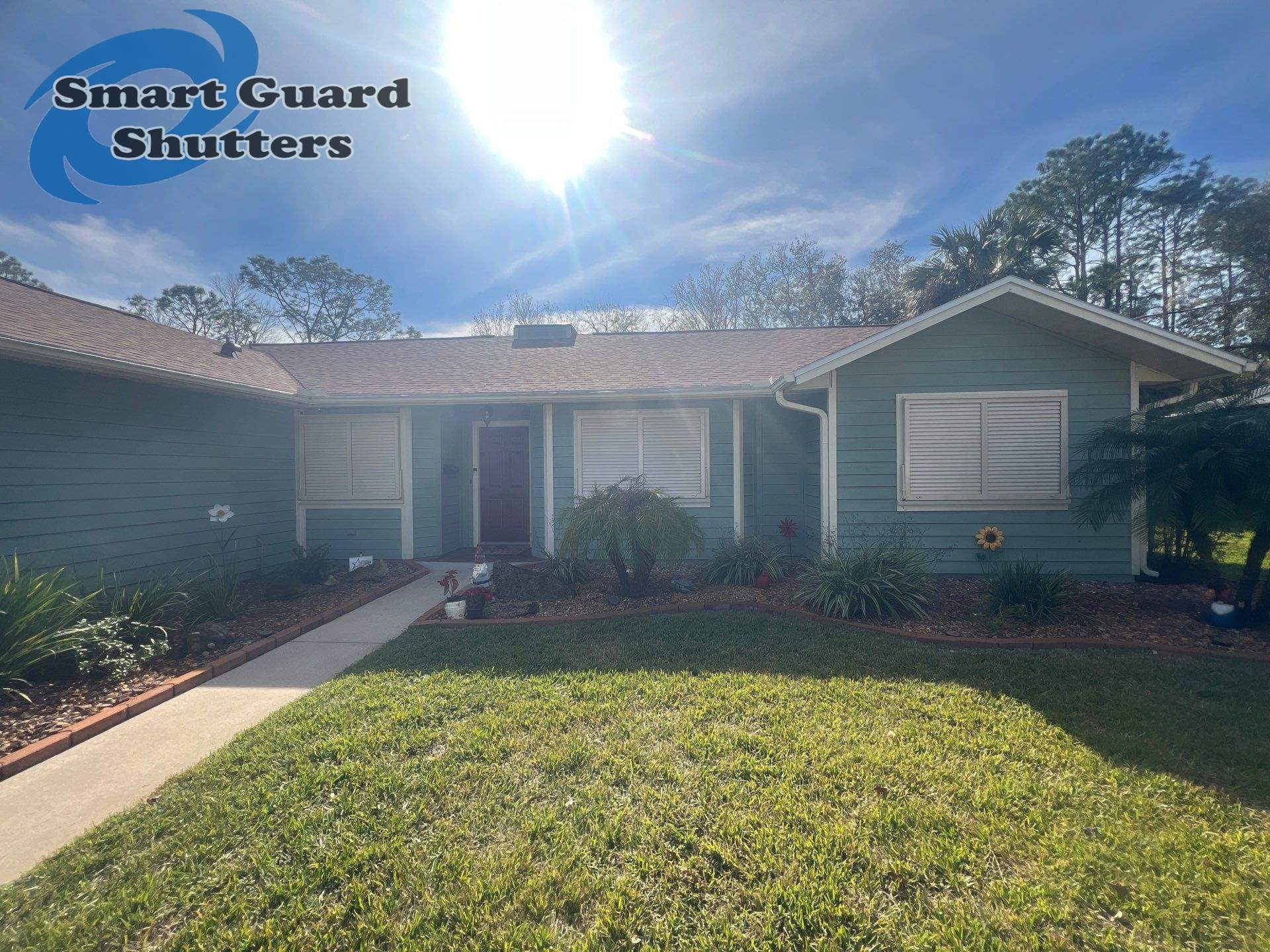 Impact Bahama Shutters in Light Ivory by Smart Guard Shutters