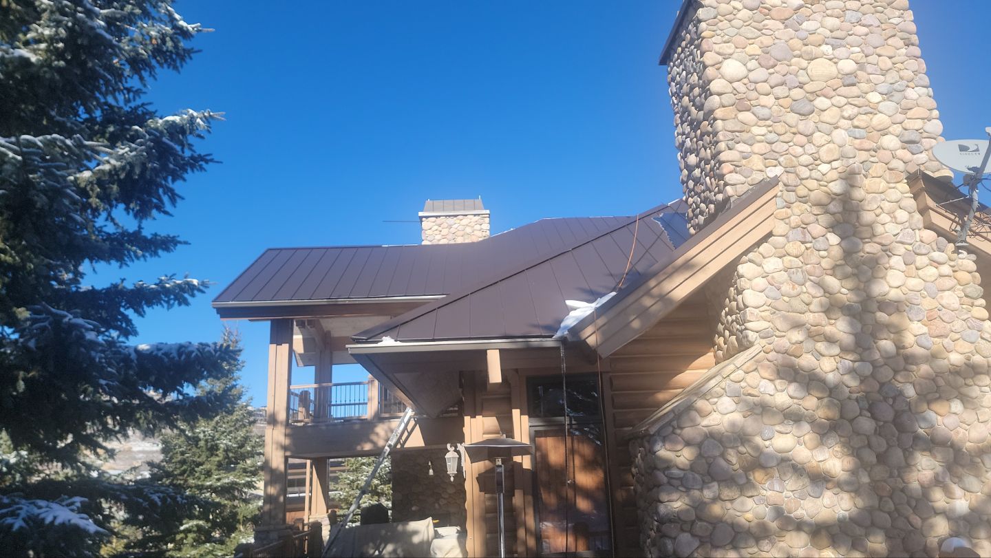Standing Seam Metal Roof Replacement After Snow Damage by ASAP Roofing & Restoration