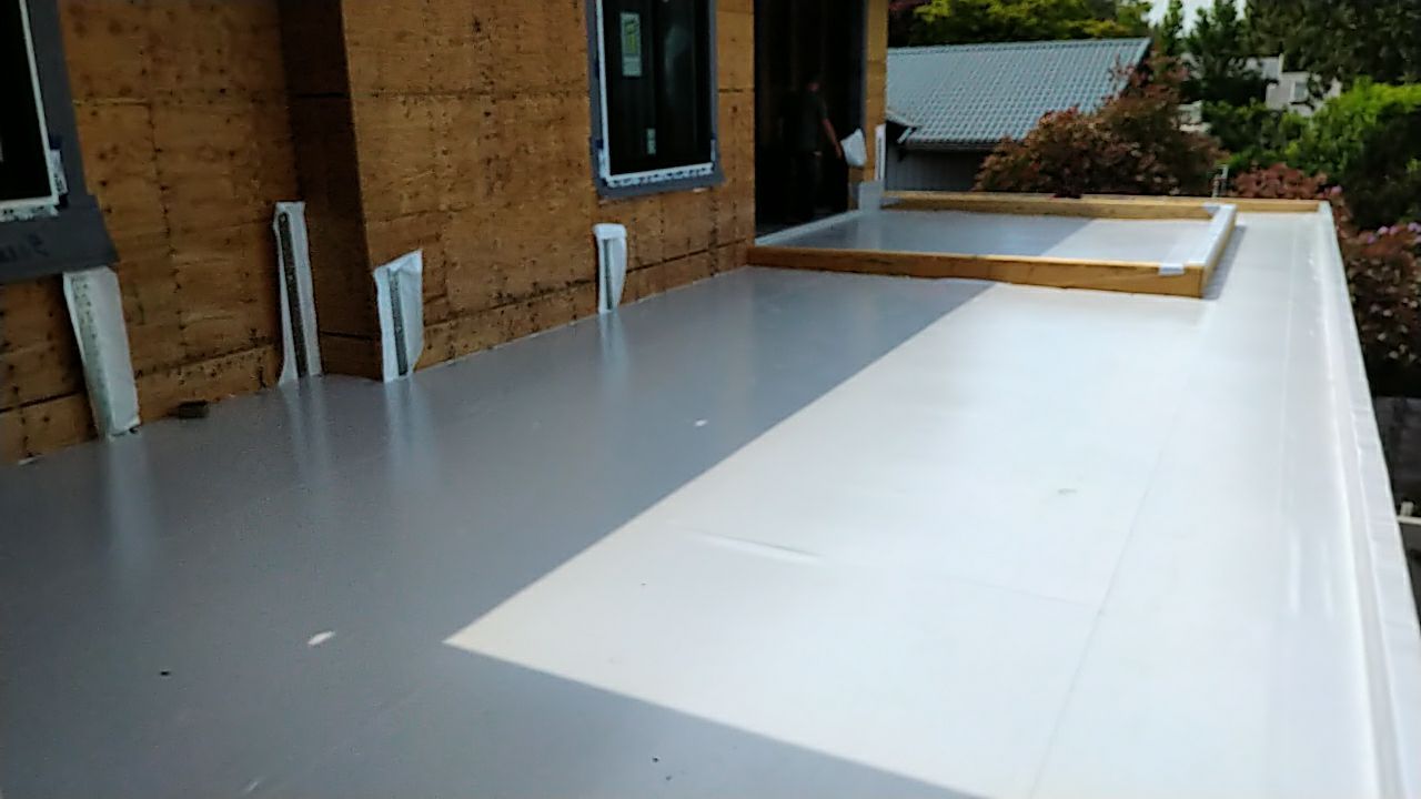 Residential Roofing Installation using Durolast roofing membrane by Top Notch Roofing Inc