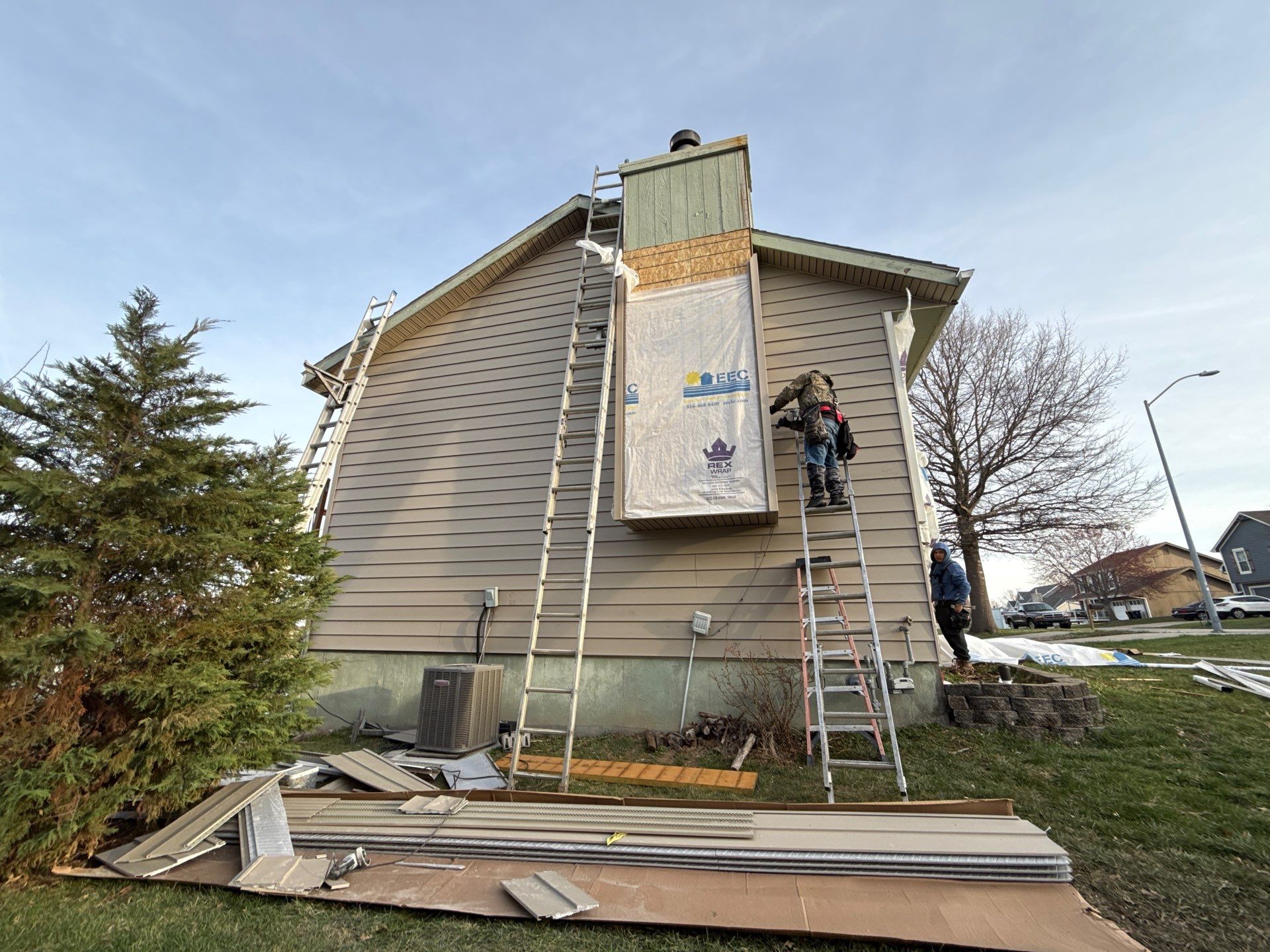 Kansas City Horizontal Vinyl Siding Installation for Split-Level Residence by EEC Windows, Siding & Roofing