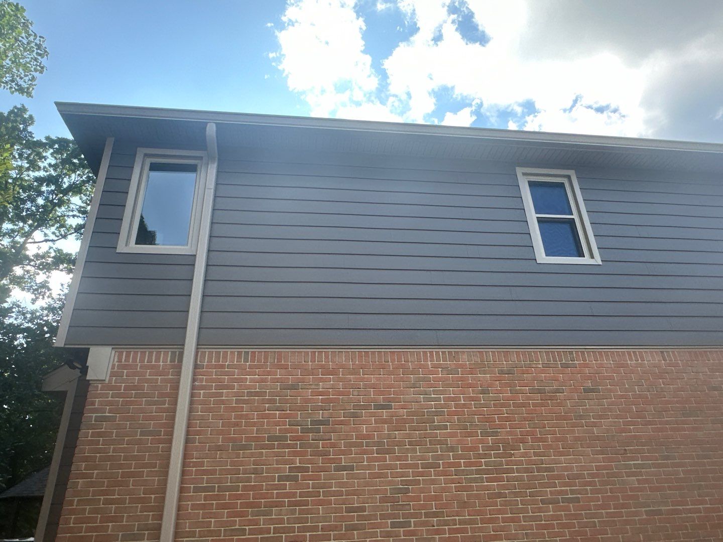 Roof Replacement using Owens Corning Peppercorn and Siding Replacement using Ascend Charcoal Smoke by 180 Contractors