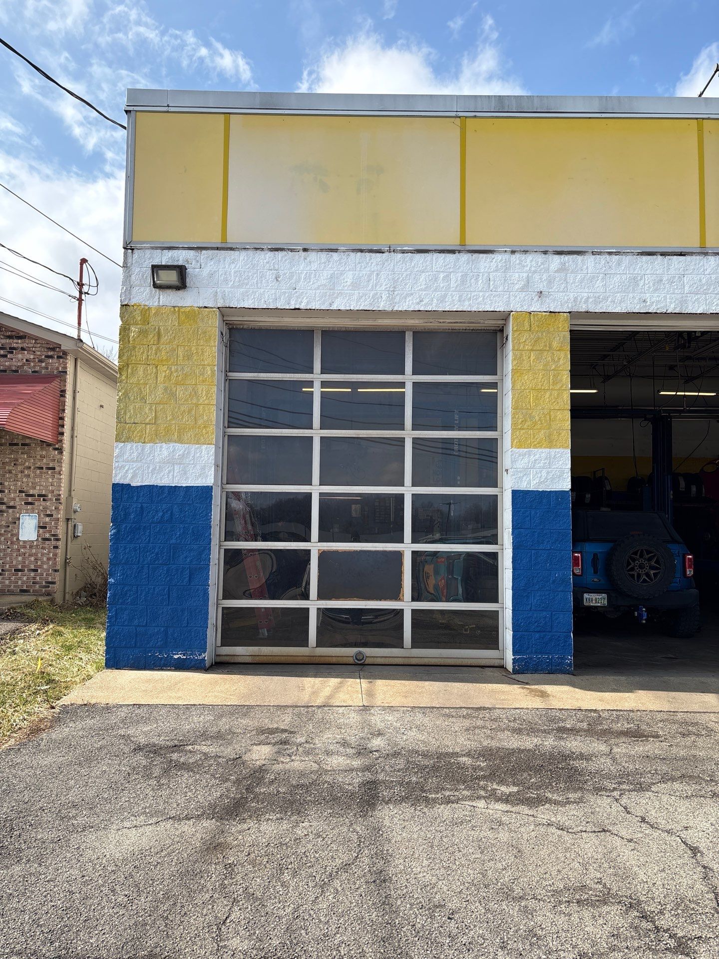 Commercial garage door repair for a local auto service shop in Warren, OH by Ohio Garage Door Repair