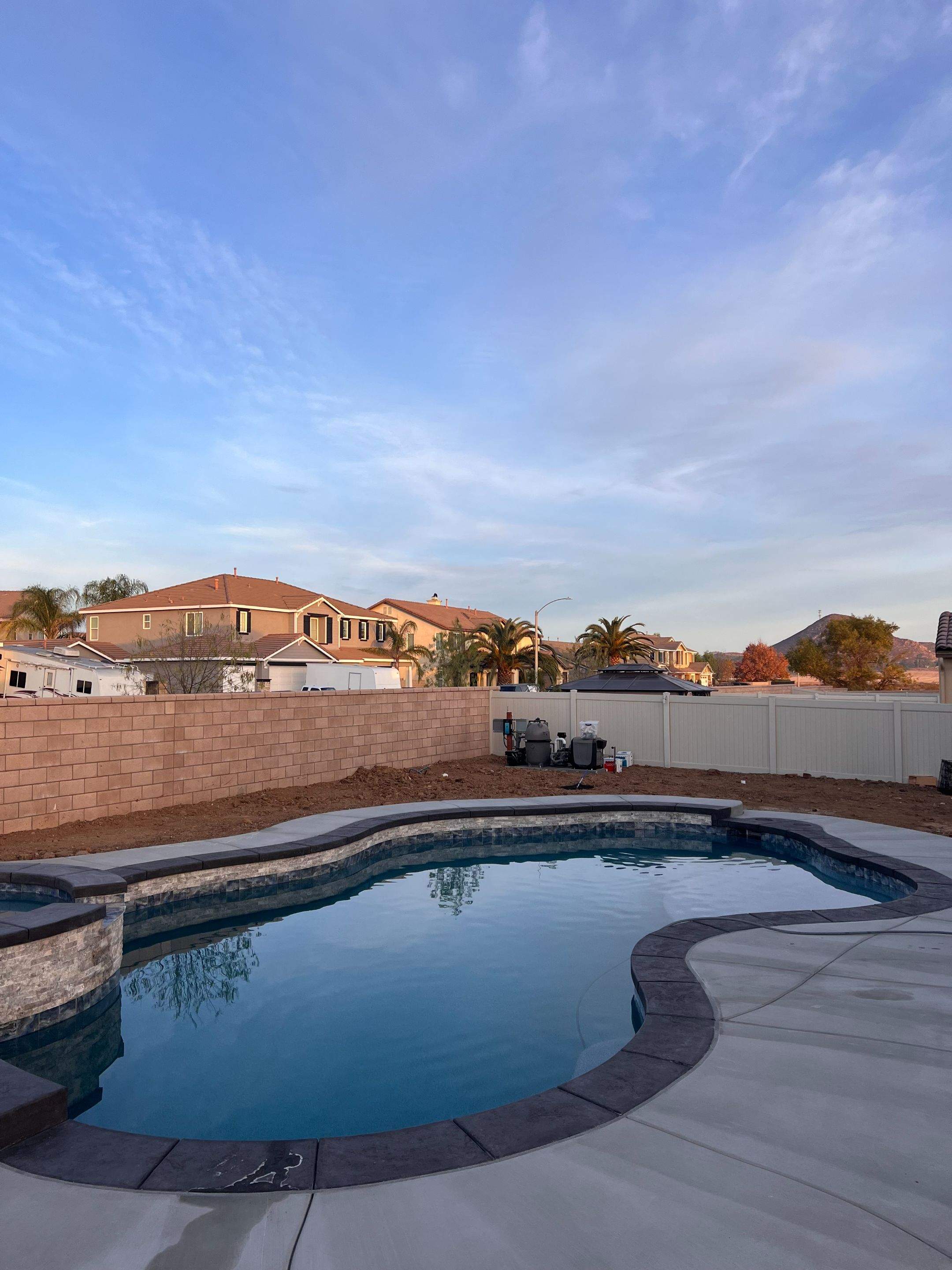 Freeform pool and spa pip coping by Premier Pools and Spas Temecula