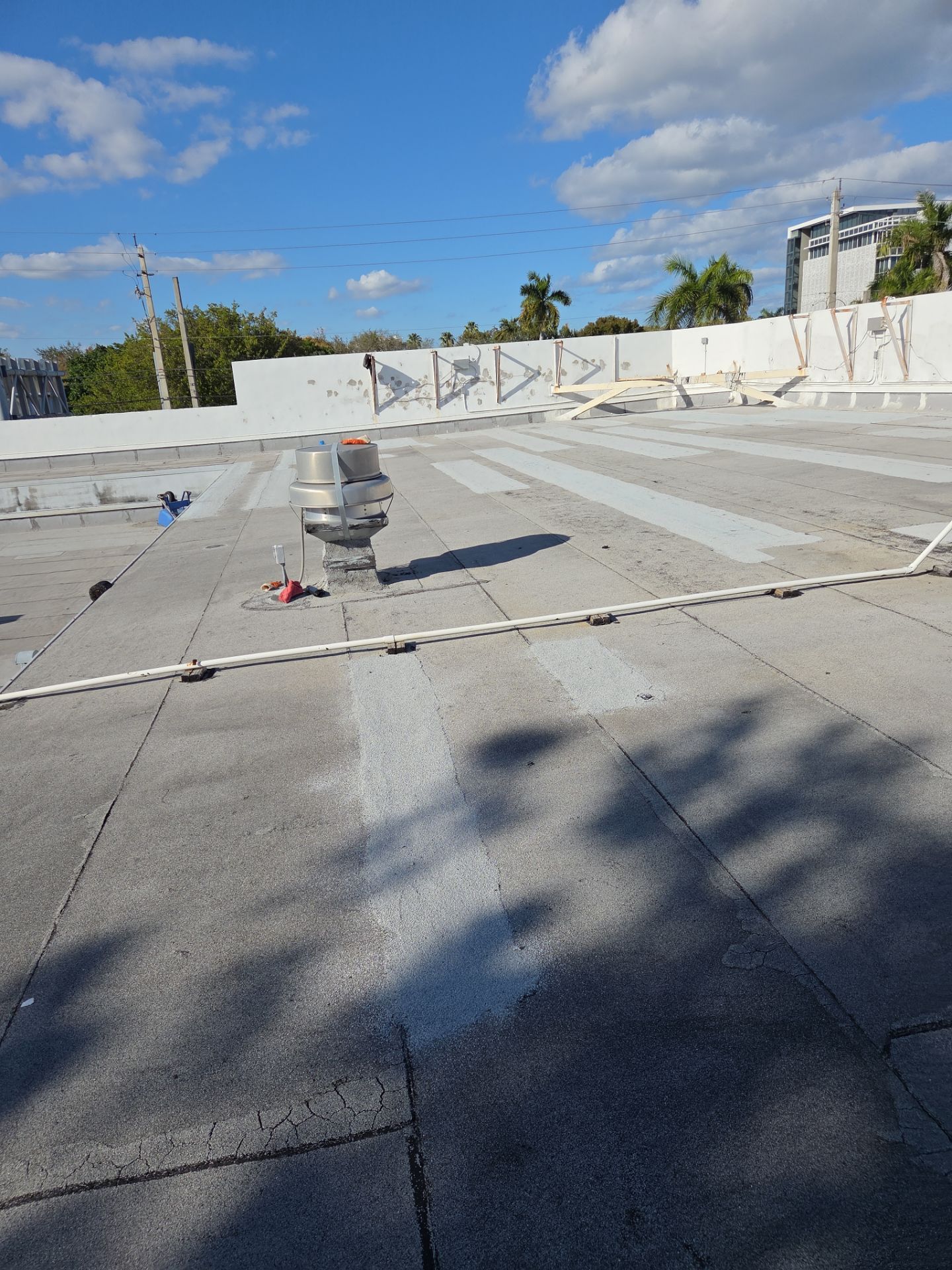 Commercial Flat Roof Restoration Using Silicone Coating in Hallandale Beach by Aastro Roofing