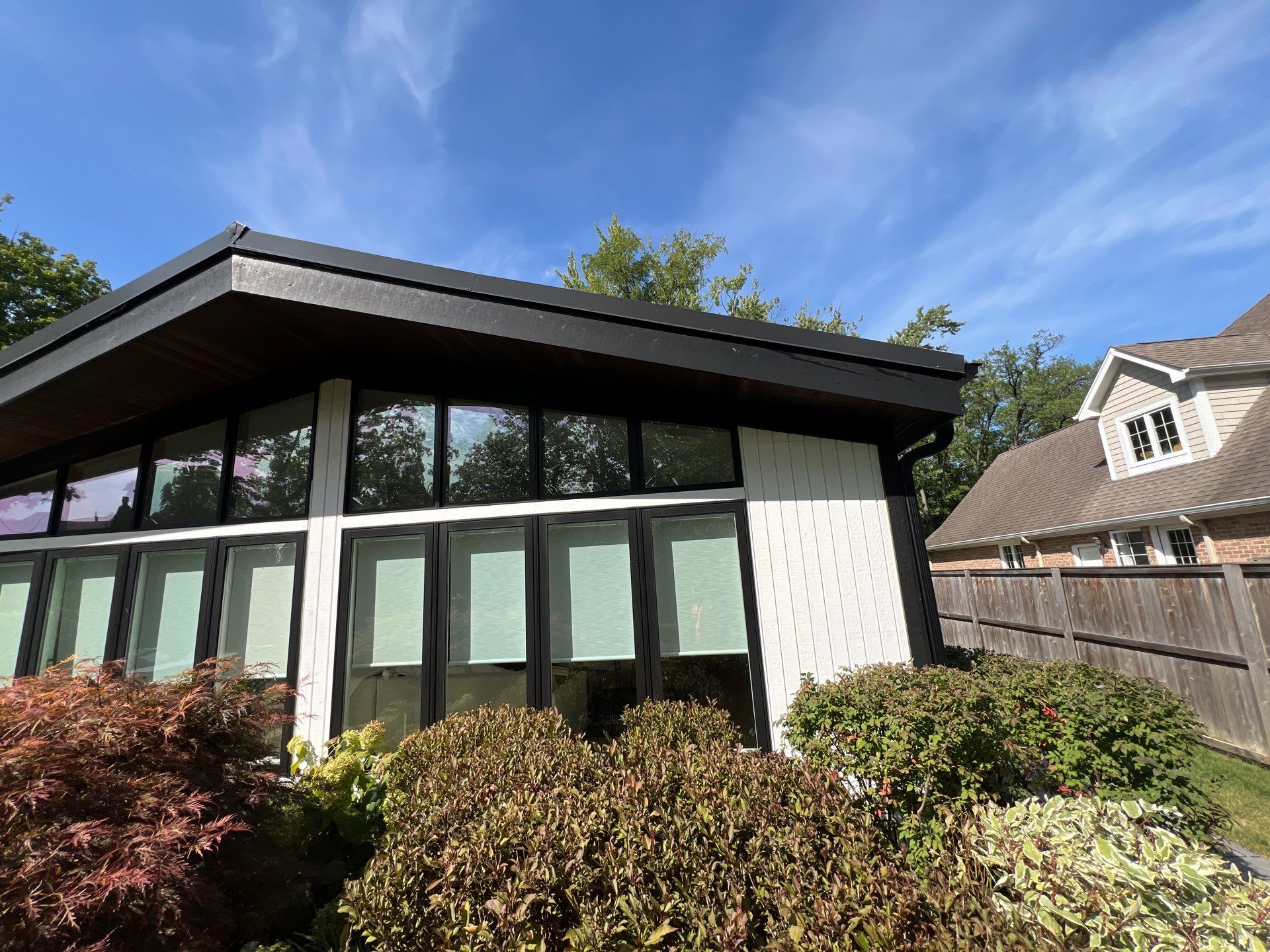Complete Exterior House, Bluestone & Garage Floor Cleaning by Northern Power Washing LLC.