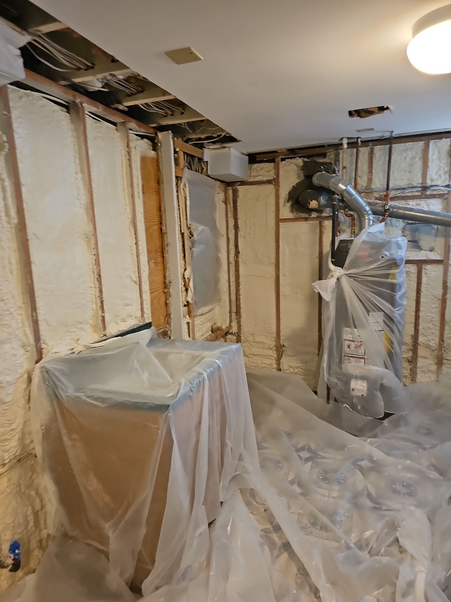 Basement Exterior Walls using Closed Cell Spray Foam by NYS Foam & Energy