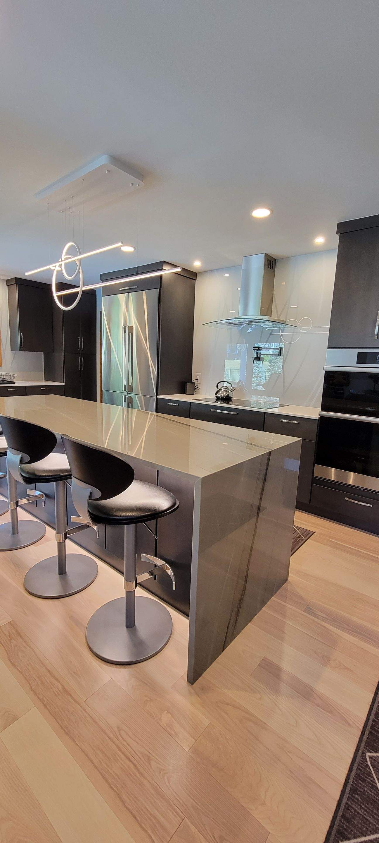 Kitchen Remodel using IMAGIO Misty Curves Solid Glass Backsplash by IMAGIO