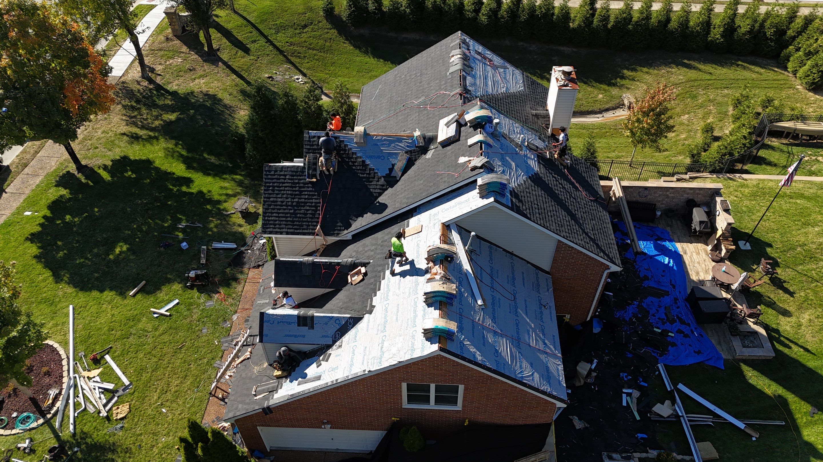 Charcoal Black Re-Roof & Gutters by Royal House LLC