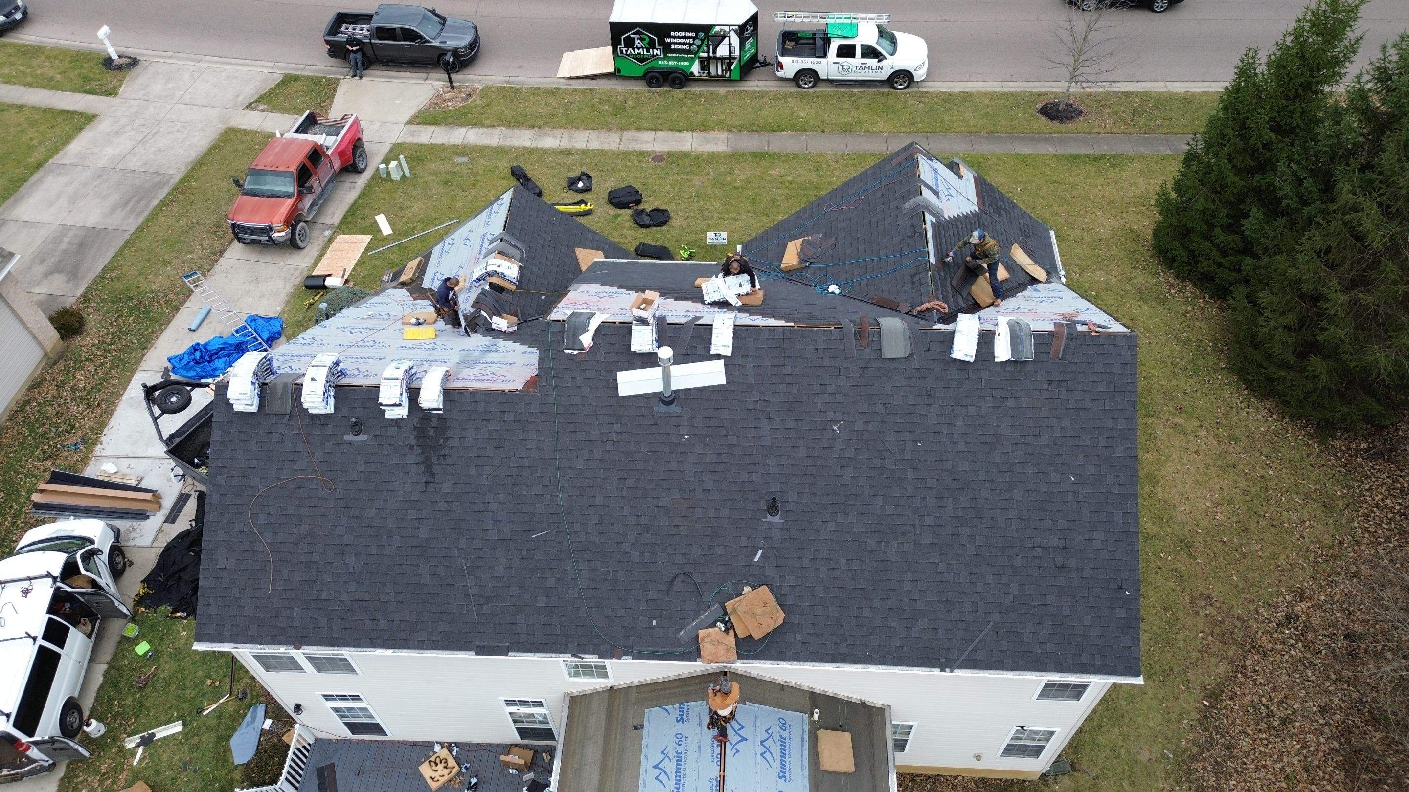 Walden Ponds - Pristine Black and Hydro Flo Gutter Guards by Tamlin Roofing