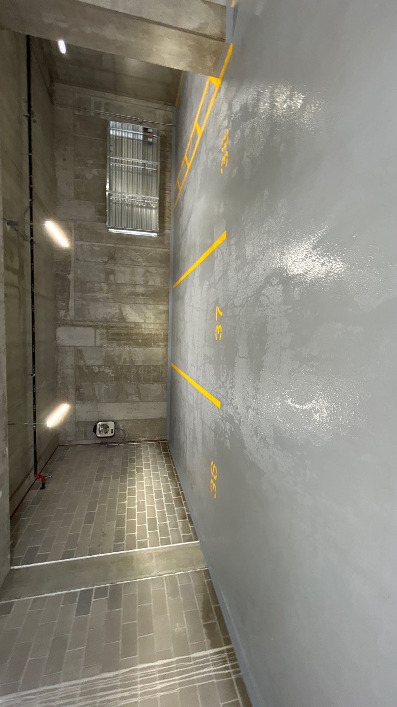 Parking garage using Hot water by Northern Power Washing LLC.