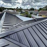 24ga 1.5" Mechanical Seam Dark Bronze by Total Roofing System The Metal Roof Experts