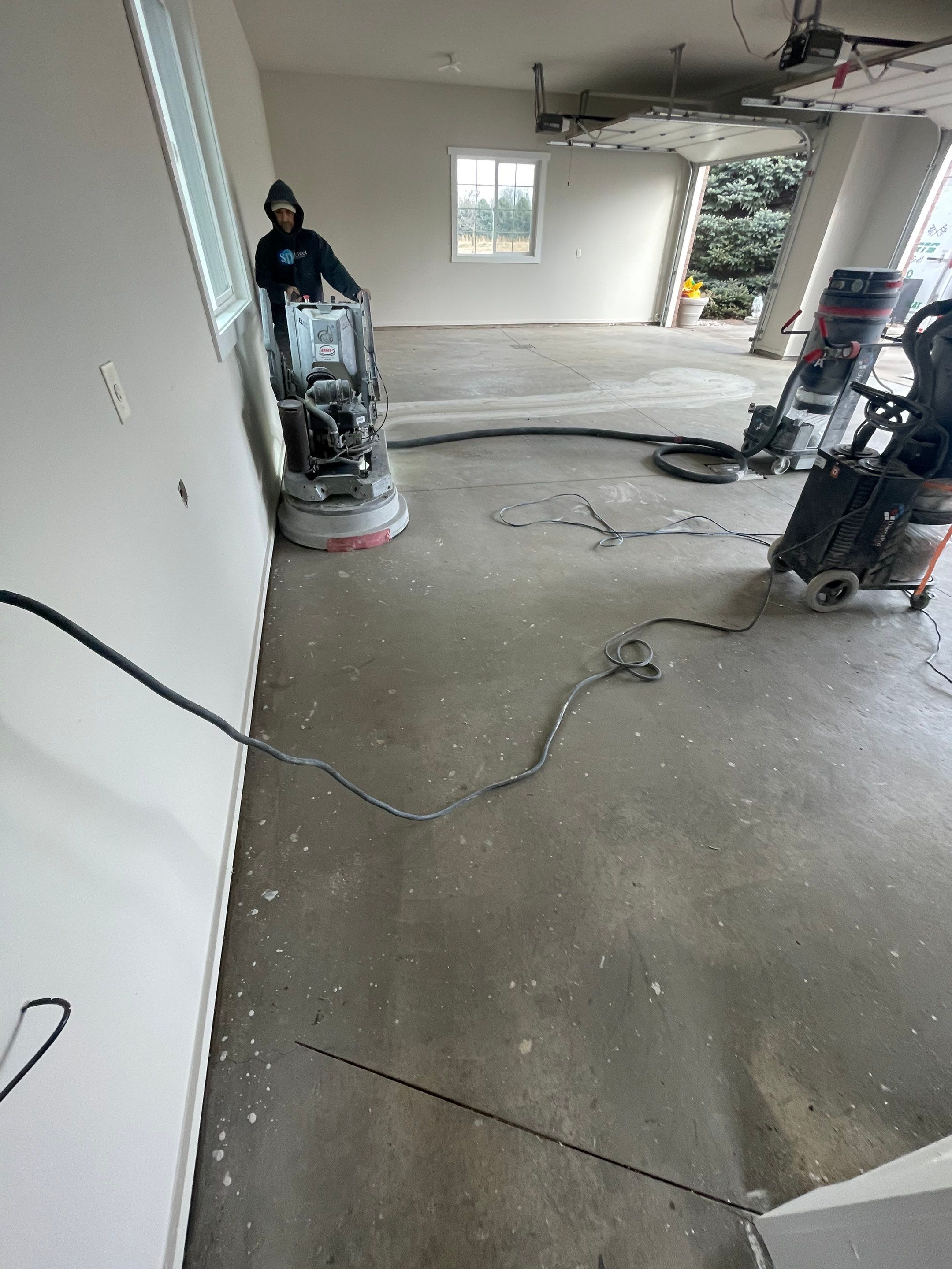 Garage transformation in Yankton by Select Painting, Coatings & Garage Cabinets