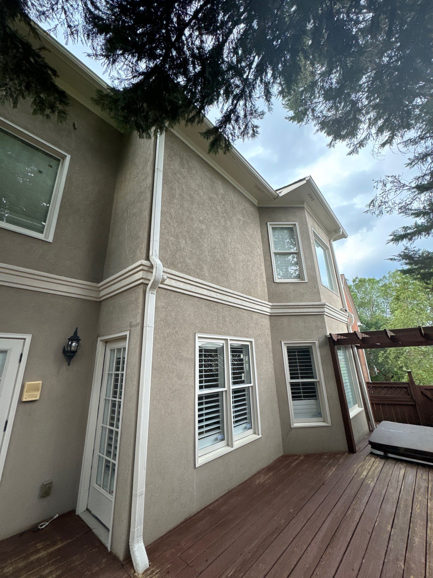 Full Exterior Stucco Painting and Wood Deck Staining in Atlanta by Swift Home Renovations