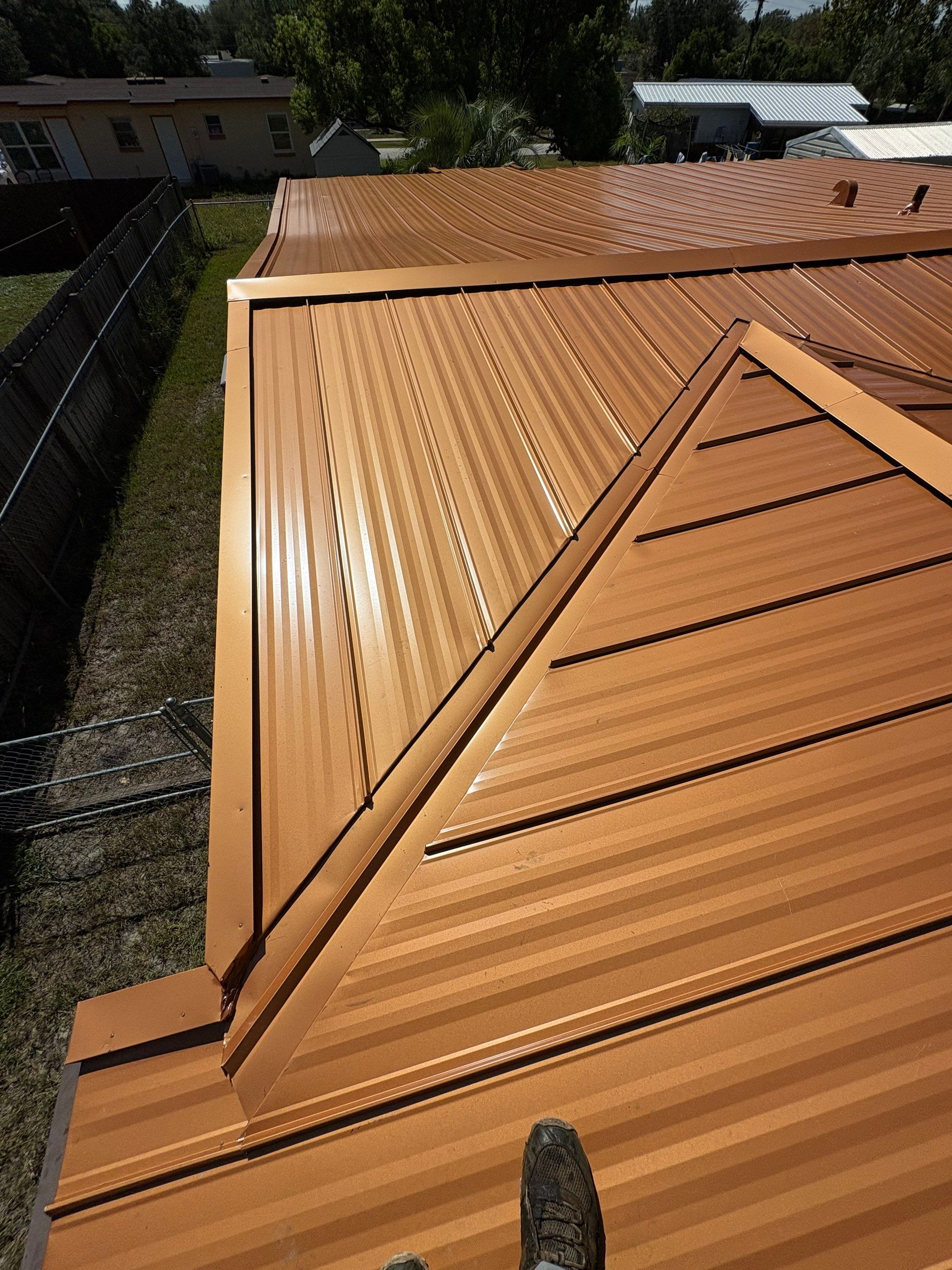 Standing Seam Metallic Copper Metal Roof Replacement in Deltona by Pinnacle Roofing Group