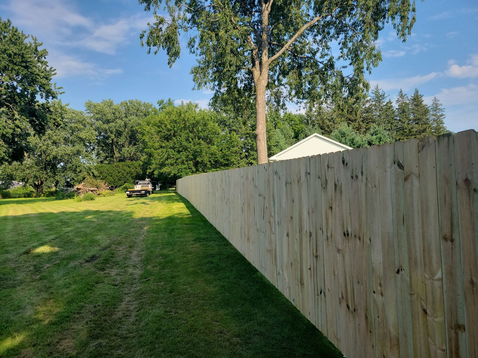 Pressure-Treated Wood Privacy Fence Replacement in Cedar Falls by Perfect Picket Fence and Stain