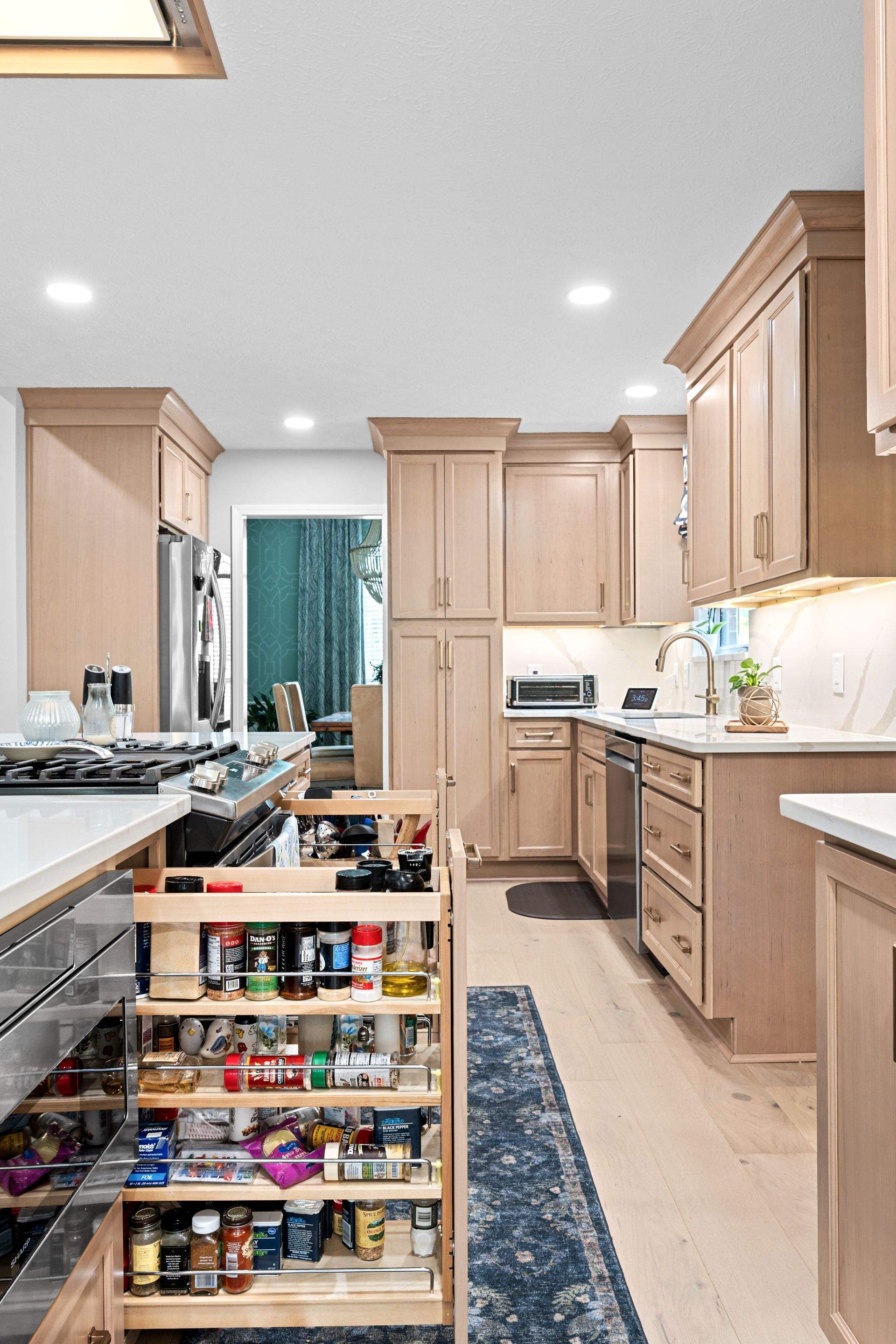 Modern Kitchen Remodel Featuring Quartz Backsplash, under cabinet lighintg, and a coffee bar in Mt. Juliet Tennessee by DeRo Renovations,LLC