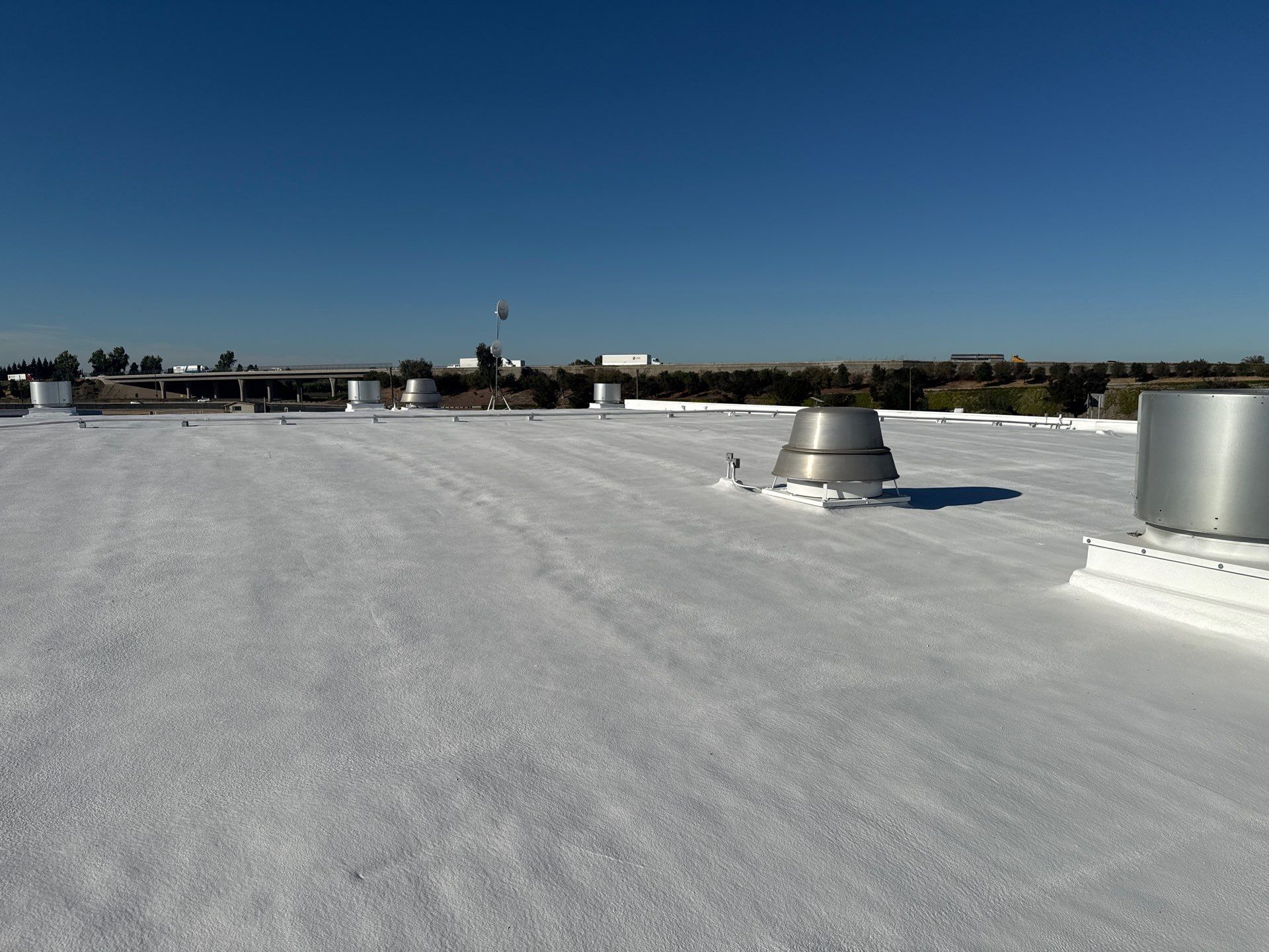 Pro Farms Spray foam roofing project by Straight Edge Roofing Inc