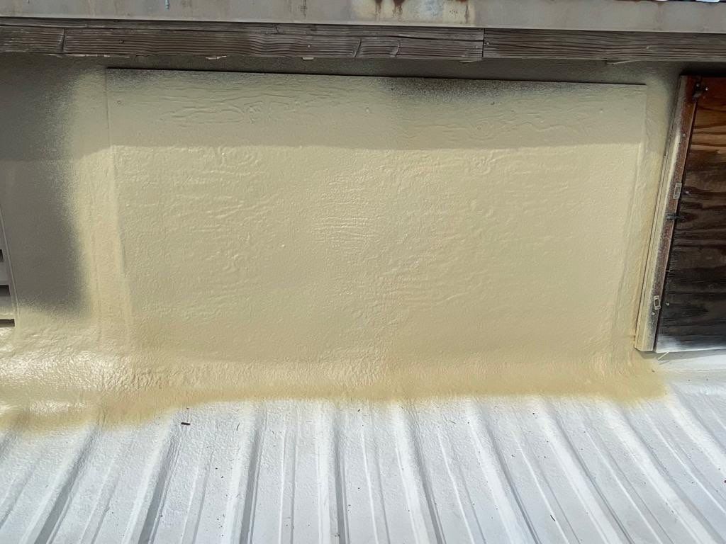 Metal roof restoration on commercial roof using Conklin Benchmark/ PUMA XL acrylic coatings over metal and foam by Straight Edge Roofing Inc