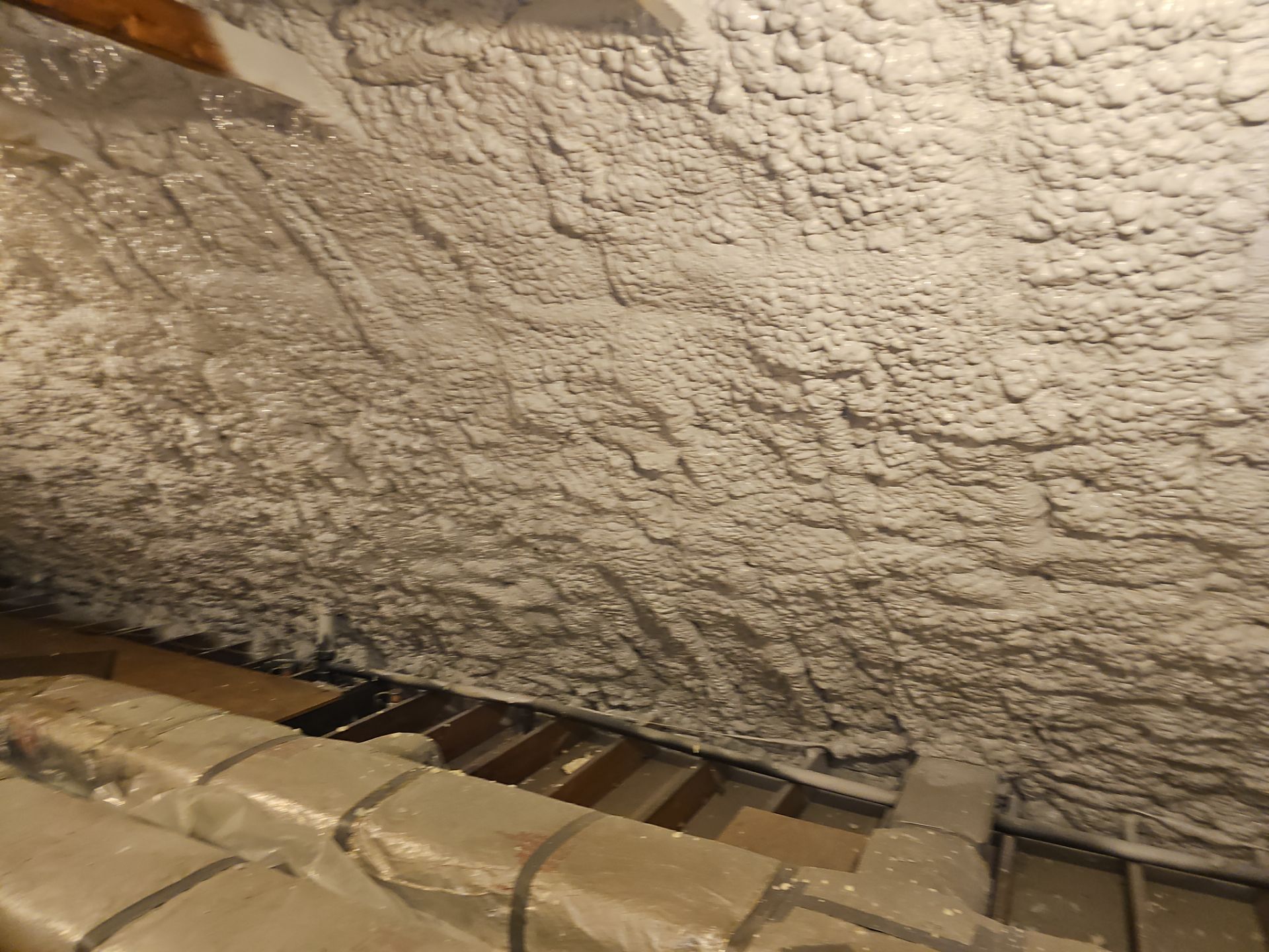 Attic Retrofit using open cell spray foam by NYS Foam & Energy