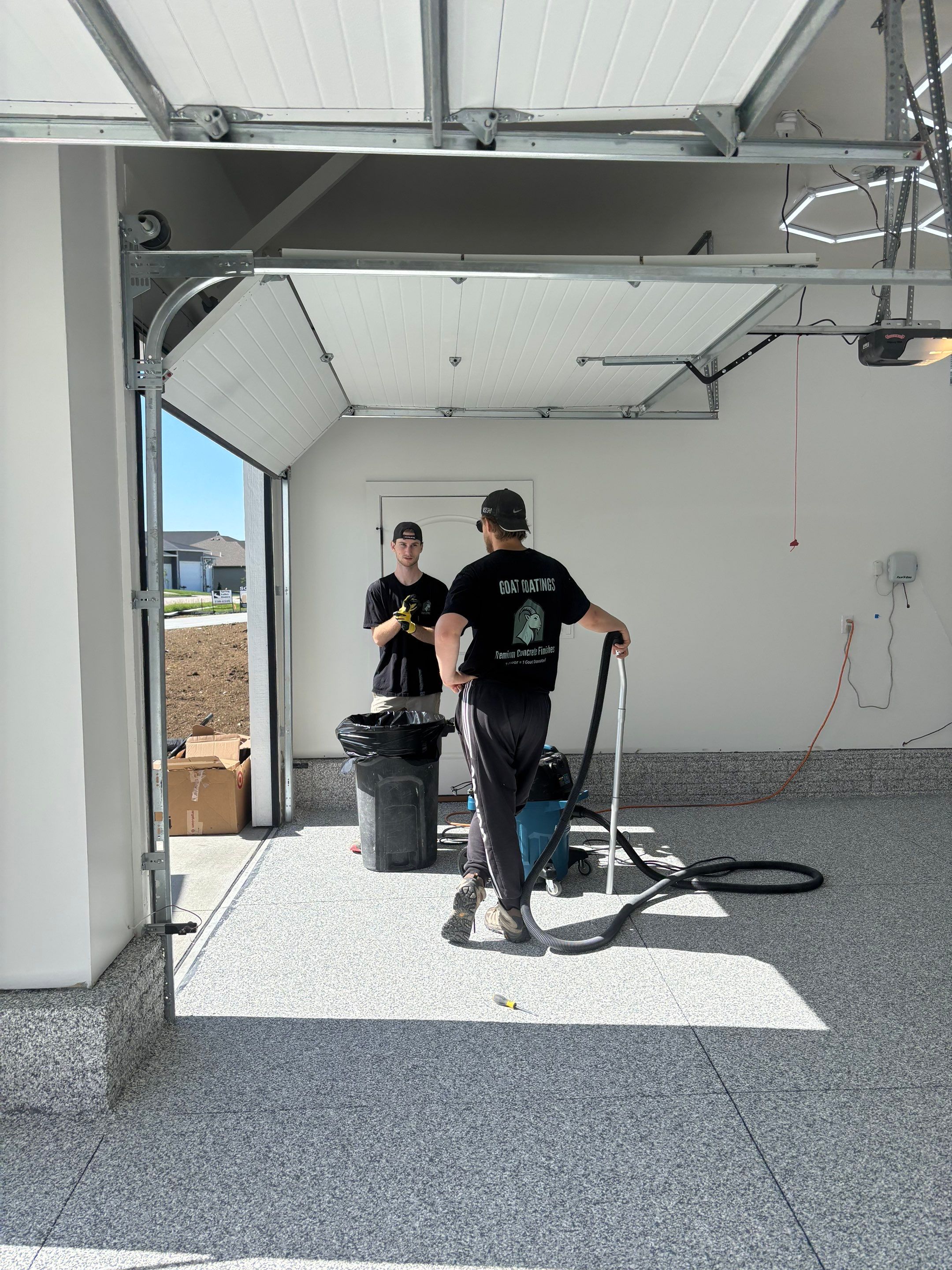 Three-Stall Garage Epoxy Floor Coating and LED Lighting in Lincoln by Goat Coatings
