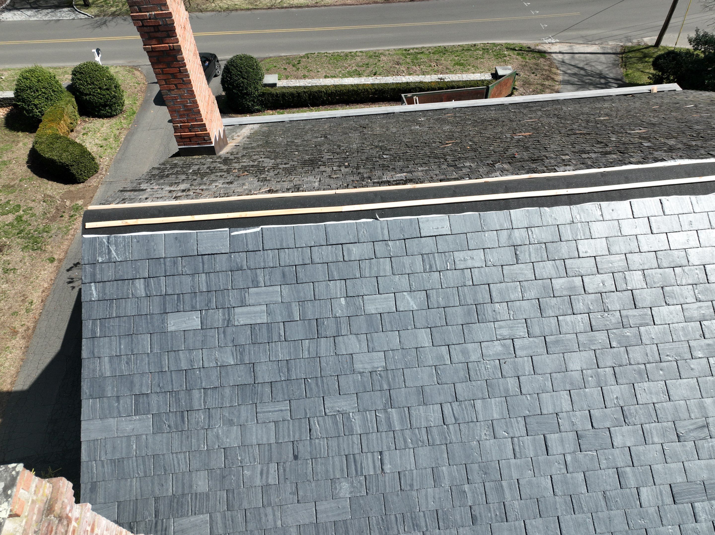Residential Roofing Installation using Vermont Slate by A Plus Exterior
