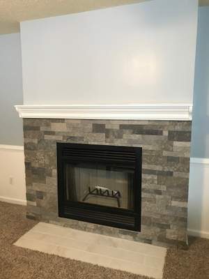 Wood Fireplace + stone + mantel
