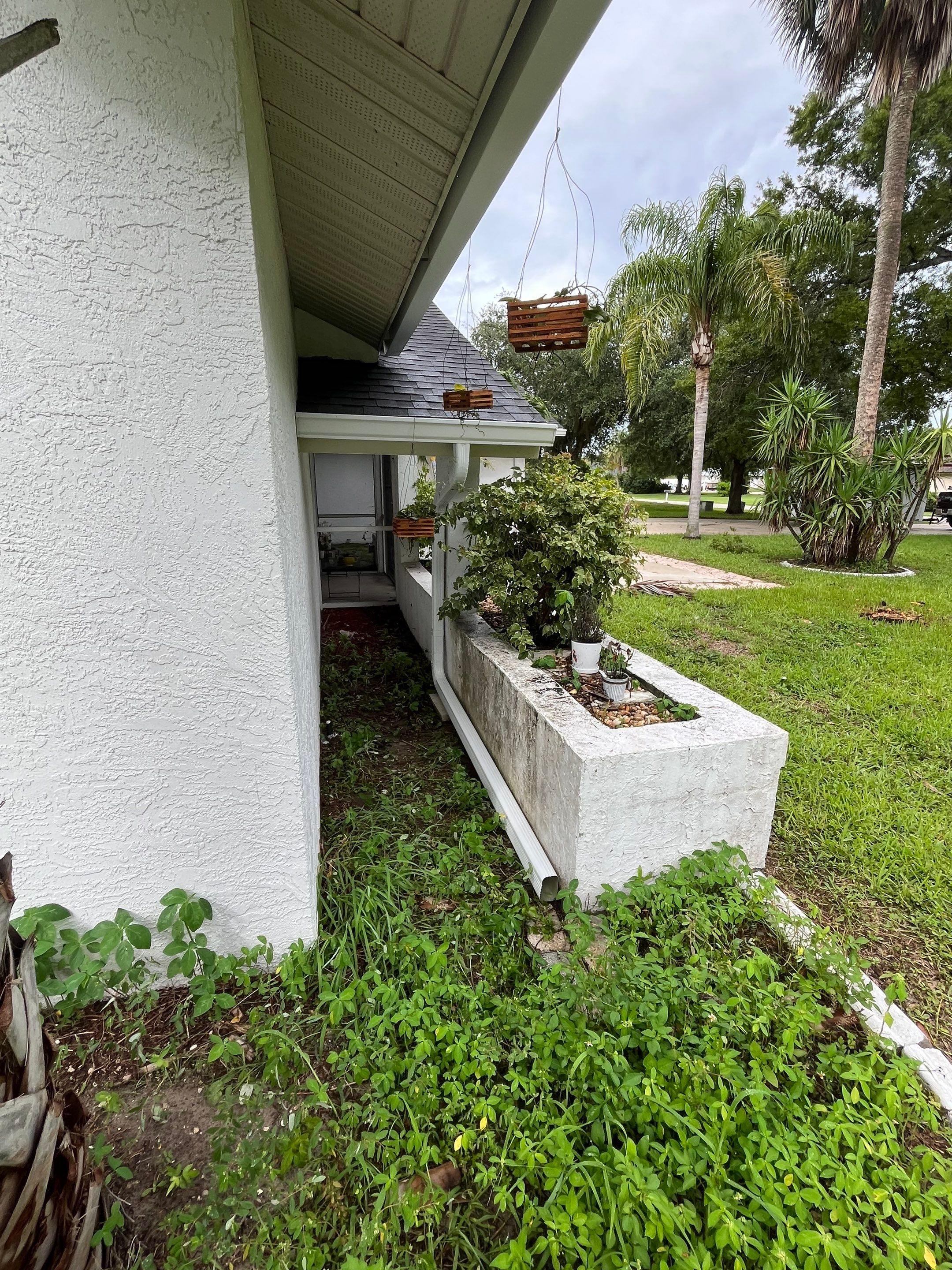 White Seamless Gutters with Splash Guards in North Fort Myers FL by Gutter Professor   by Gutter Professors