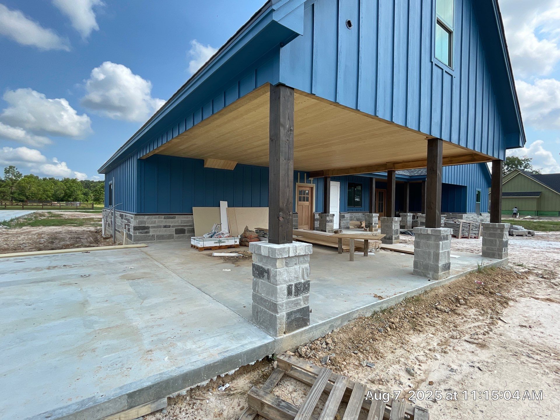 Natural Stone Elegance: Apex Installation Accented by Blue Siding by Apex Conventional Stucco Llc