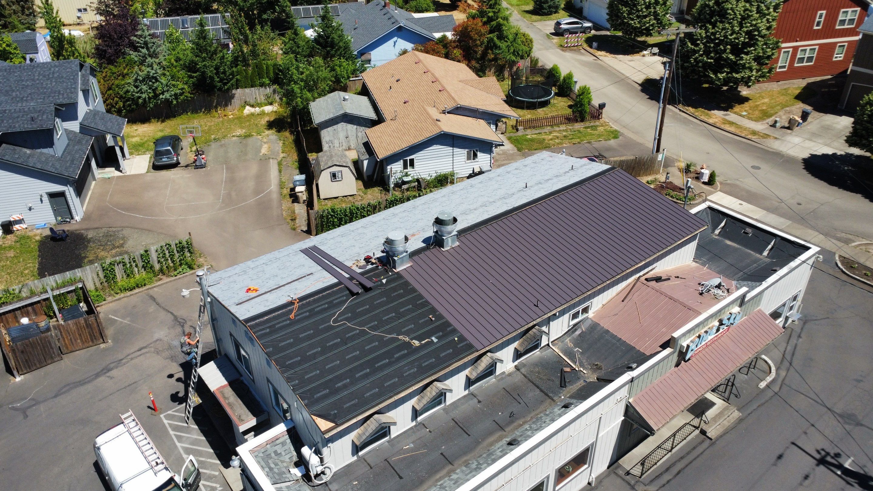 Commercial Flat Roof Installation using Bruce and Dana Snap Lock Metal (Color: Brown) by Orezona Building & Roofing Company, Inc.