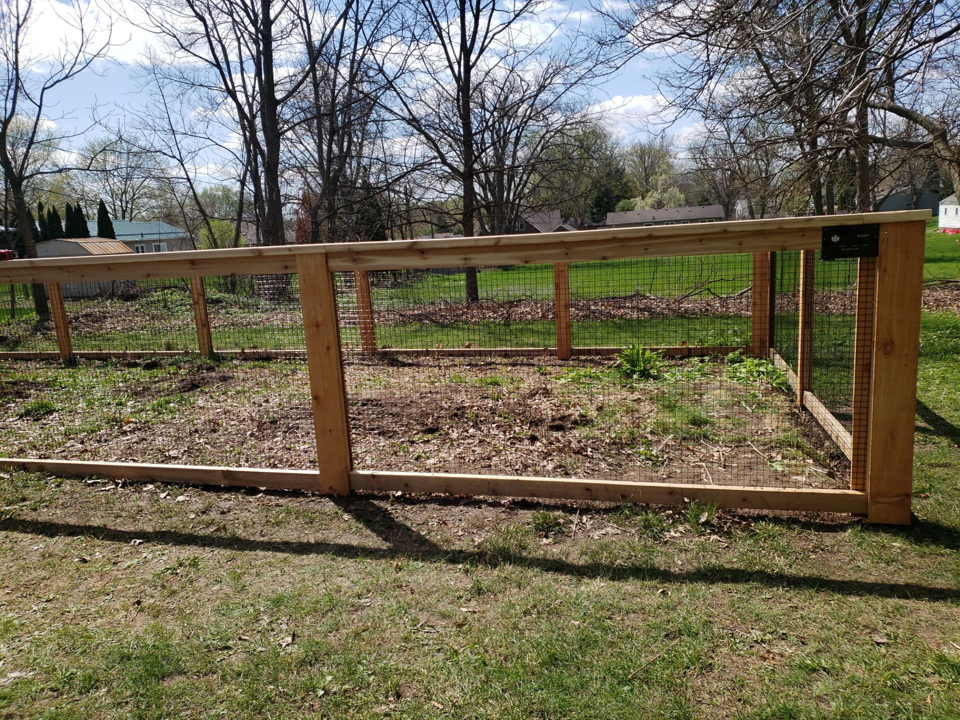 Custom Cedar Wood Garden Fence Installation in Cedar Falls by Perfect Picket Fence and Stain