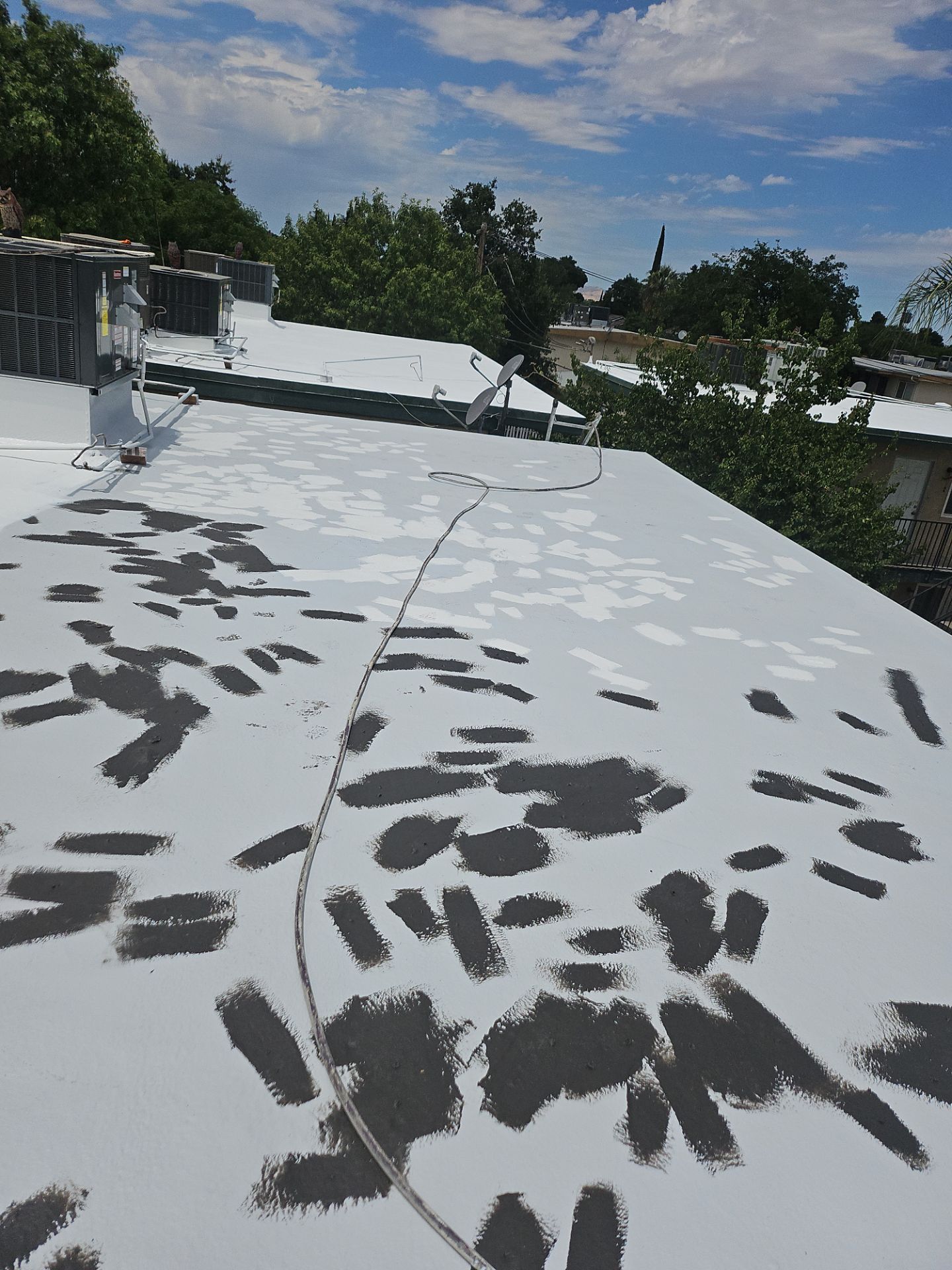 Foam Refurbish using General Coatings acrylic coatings and spray foam by Straight Edge Roofing Inc