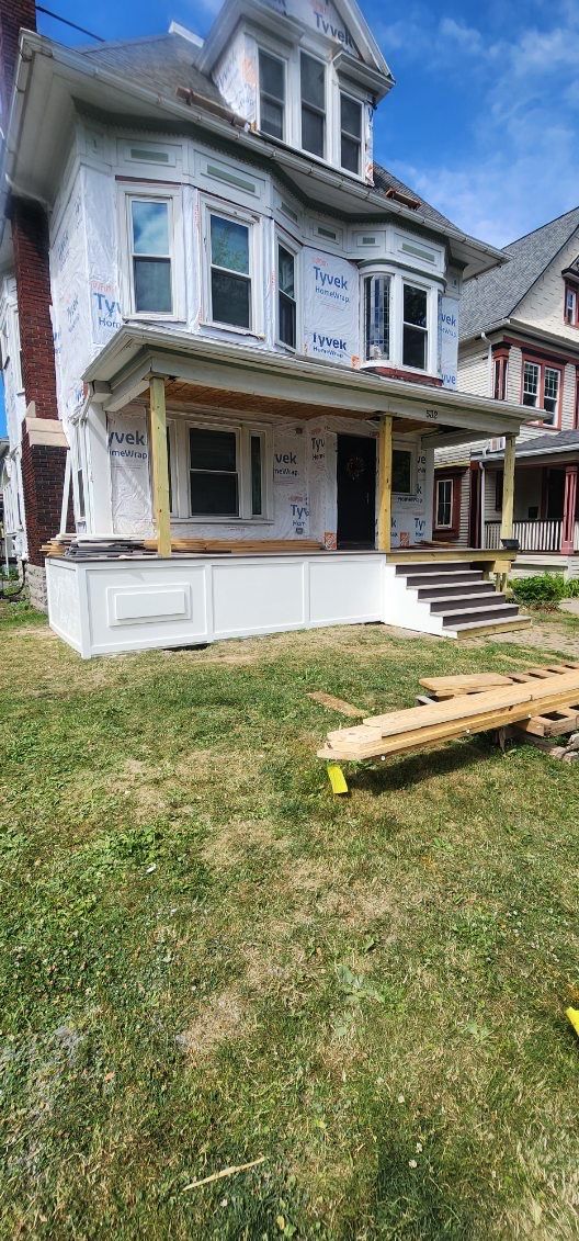 Exterior Renovations- Siding, Stamped Concrete, Porch, and Railings by Ivy Lea Construction