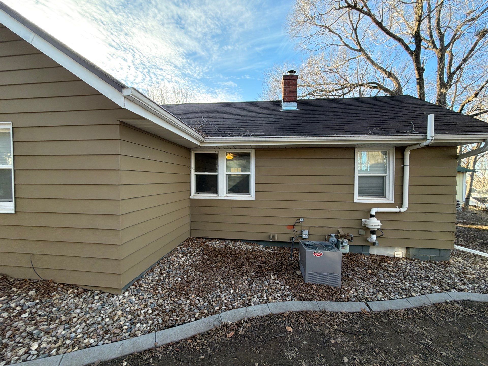Exterior Siding Repair and Full House Repaint in Sioux Falls by Select Painting, Coatings & Garage Cabinets